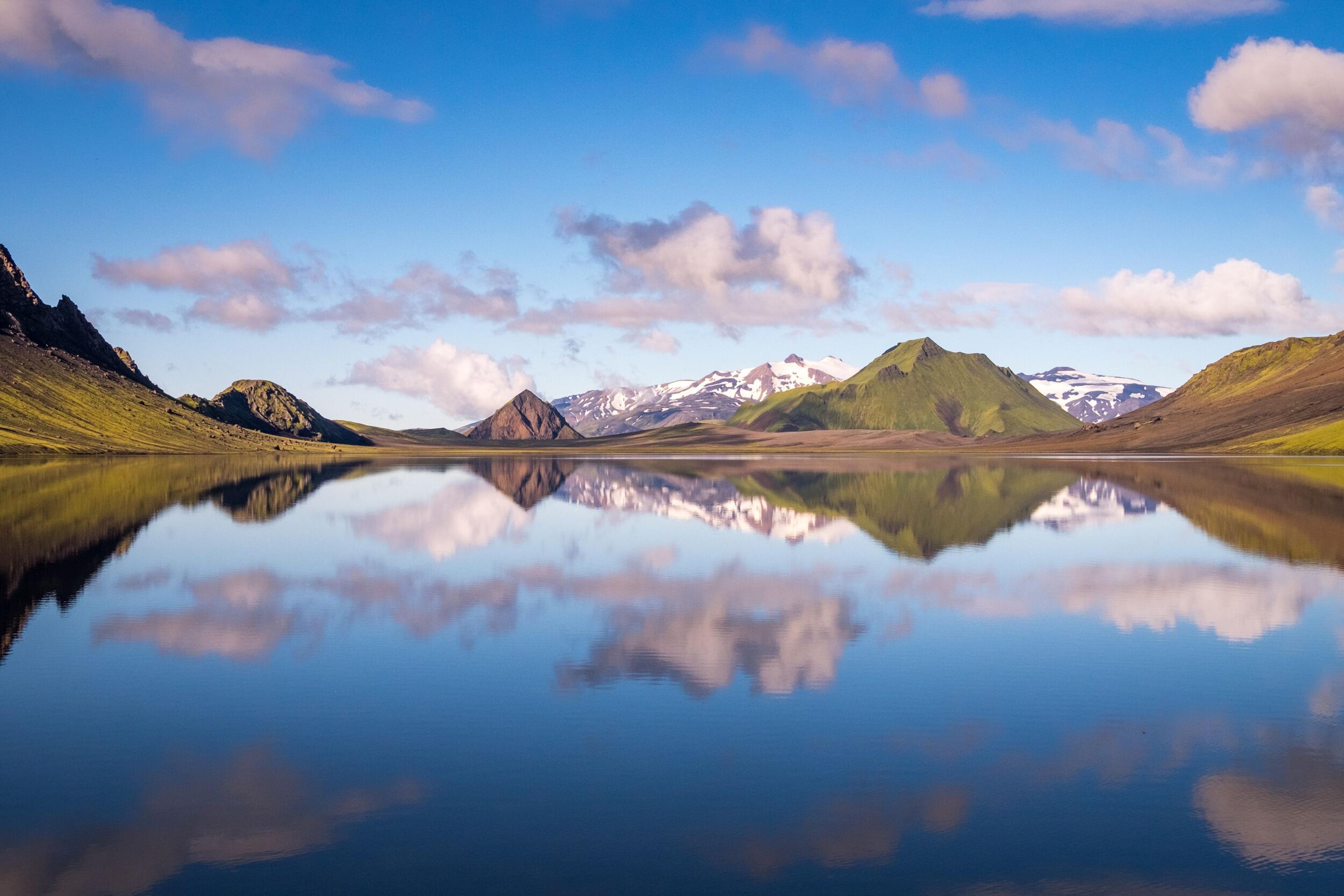 "Stunning landscape of mountains reflecting perfectly in the calm waters of a lake.