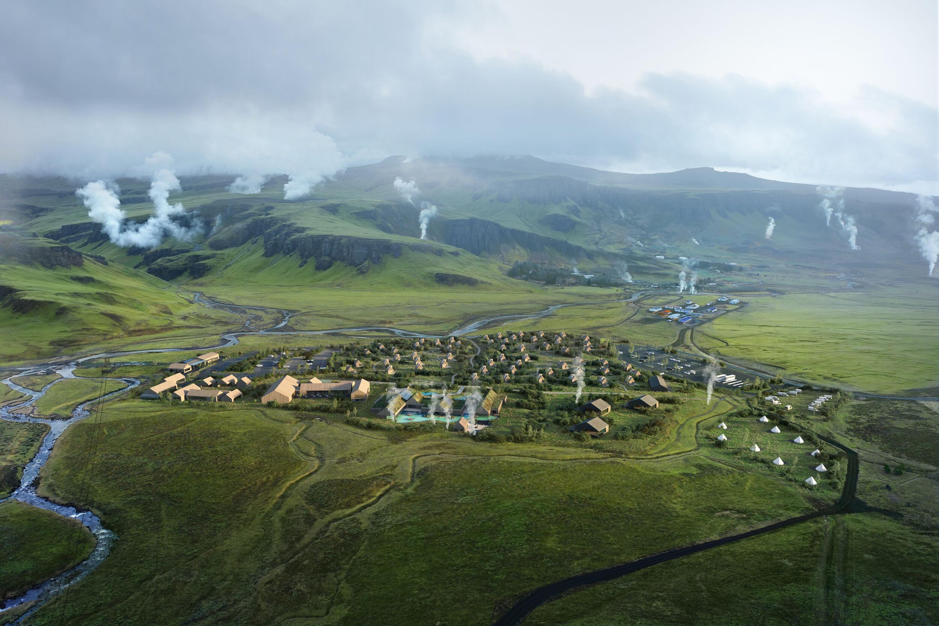 Aerial view of a modern village with tents in a green valley, surrounded by geothermal steam plumes.