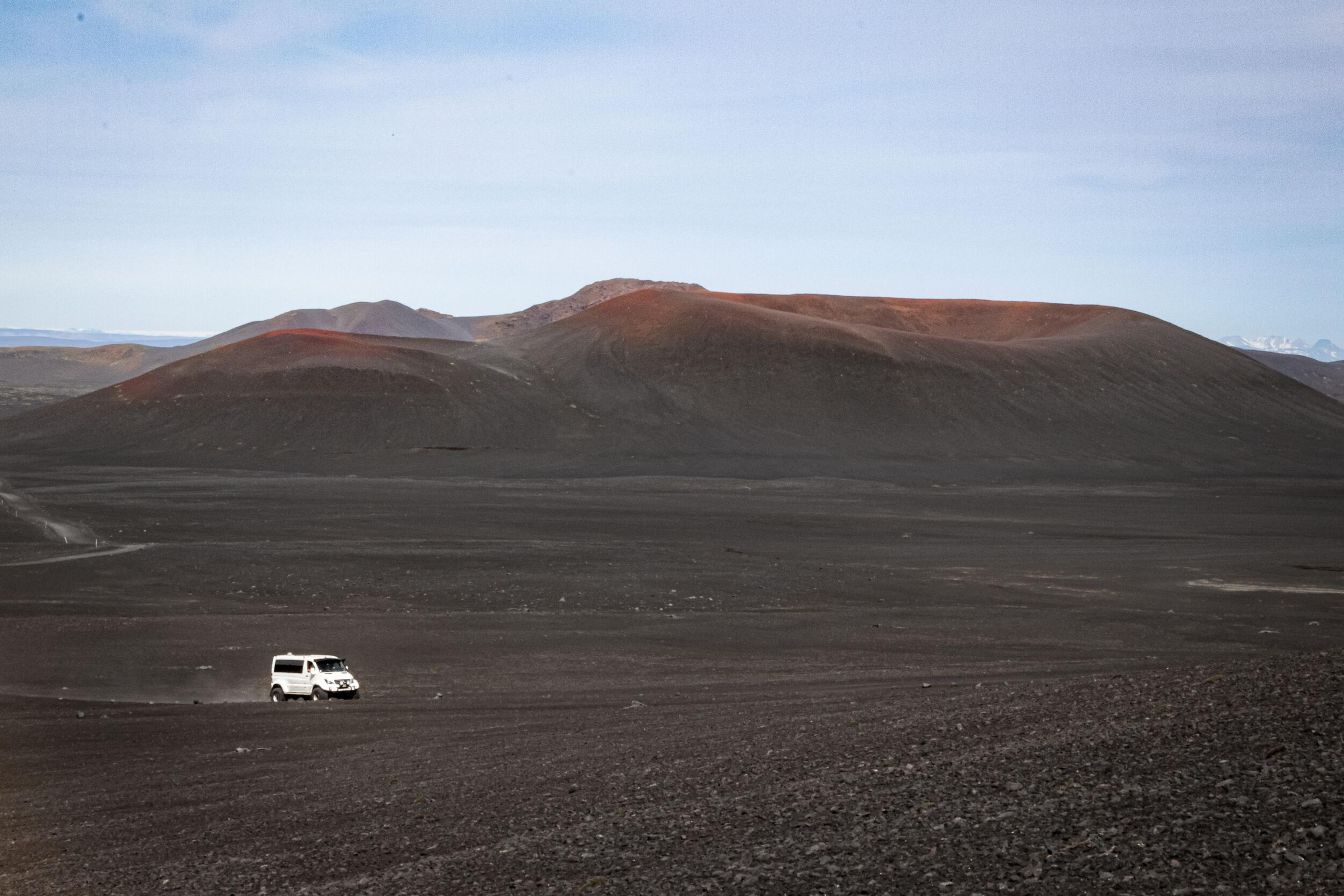 Superjeep driving through a desolate area in the Iceland Highlands on a Landmannalaugar tour.