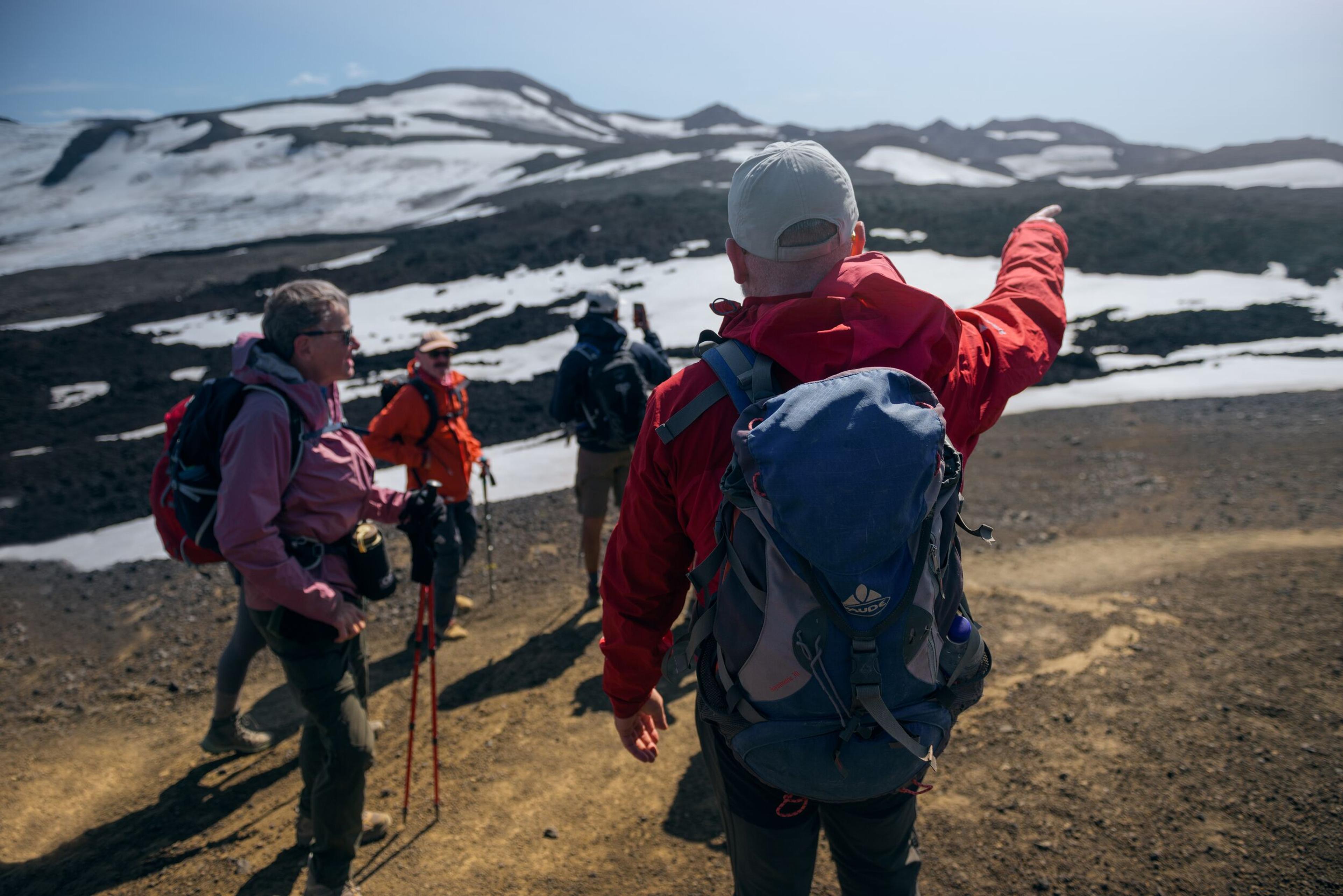 Hikers engaged in conversation while trekking the Laugavegur trail.