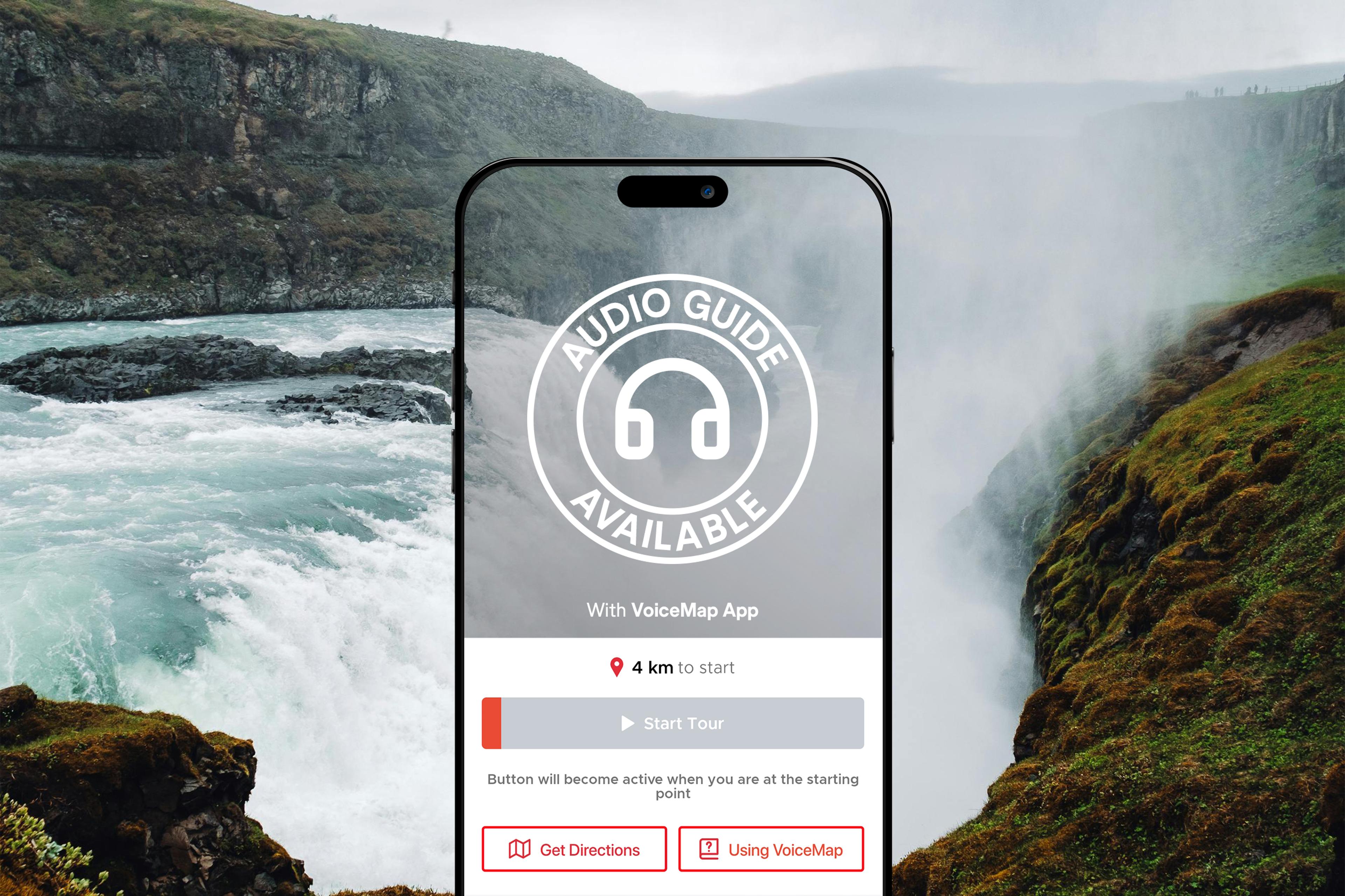 A smartphone screen displaying a VoiceMap app interface is superimposed over a scenic waterfall, with a circular "Audio Guide Available" icon in the center.