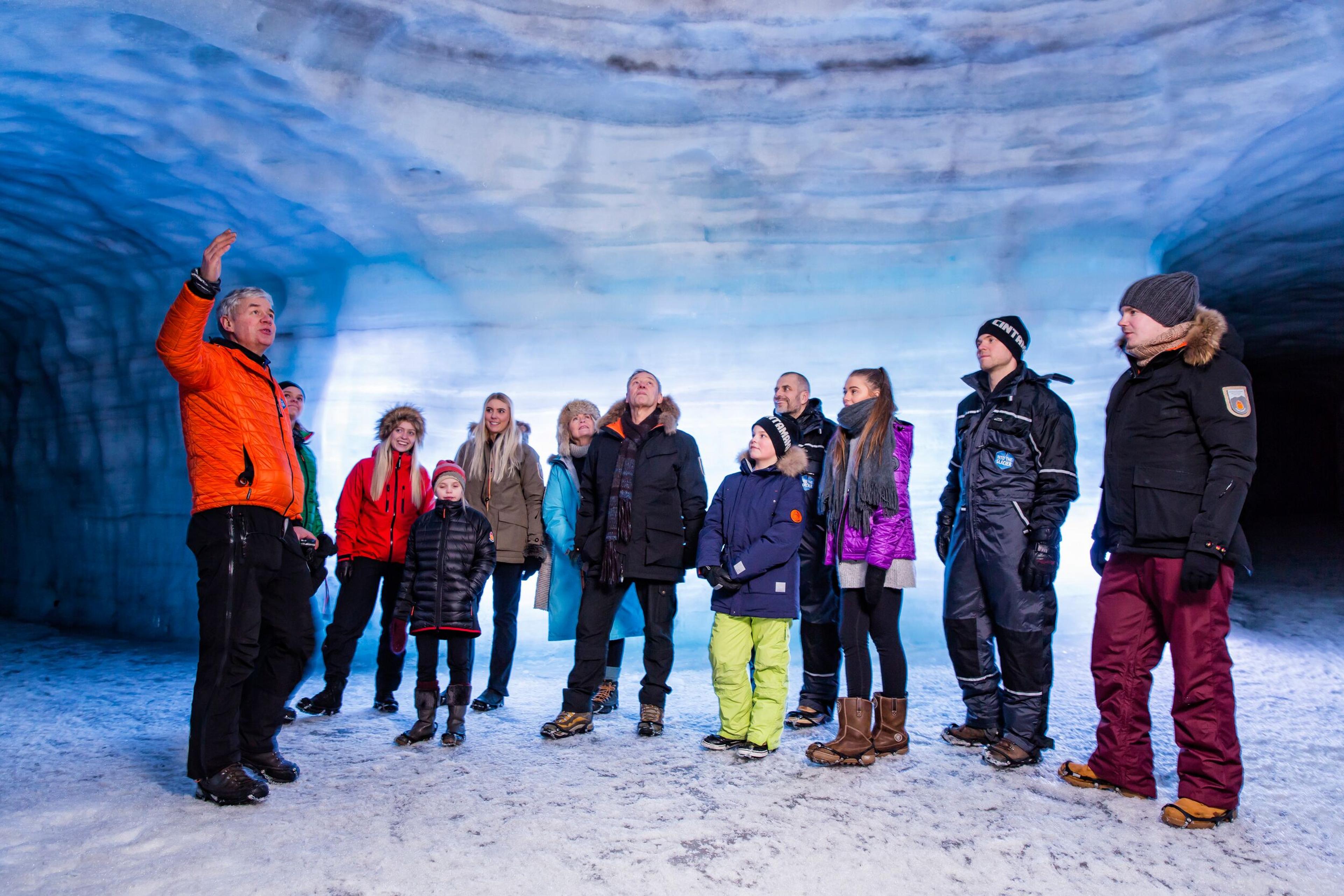 A guide with a group of tourists inside the Langjökull Ice cave in Iceland.