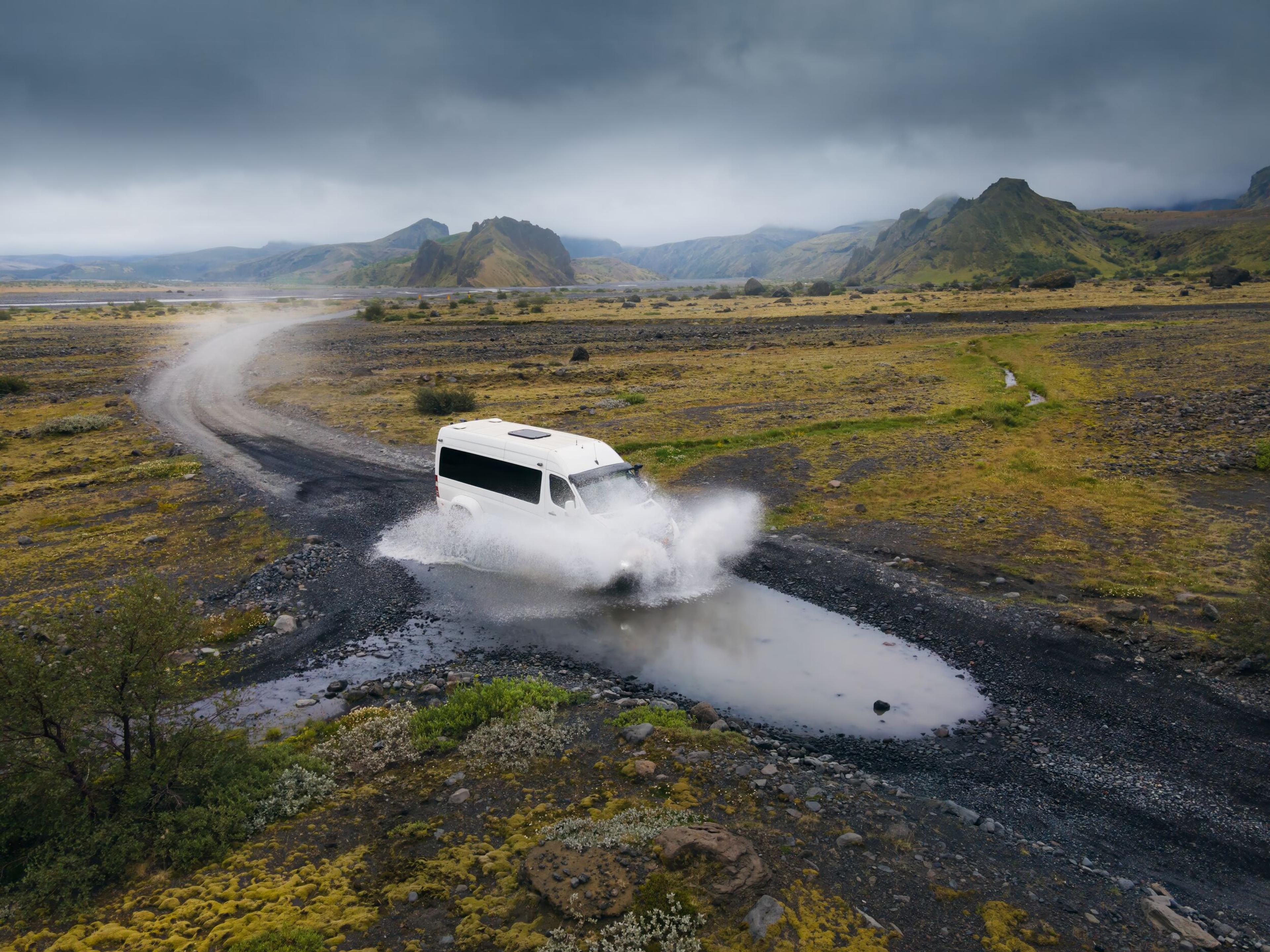Super-jeep traversing water on the icelandic highlands