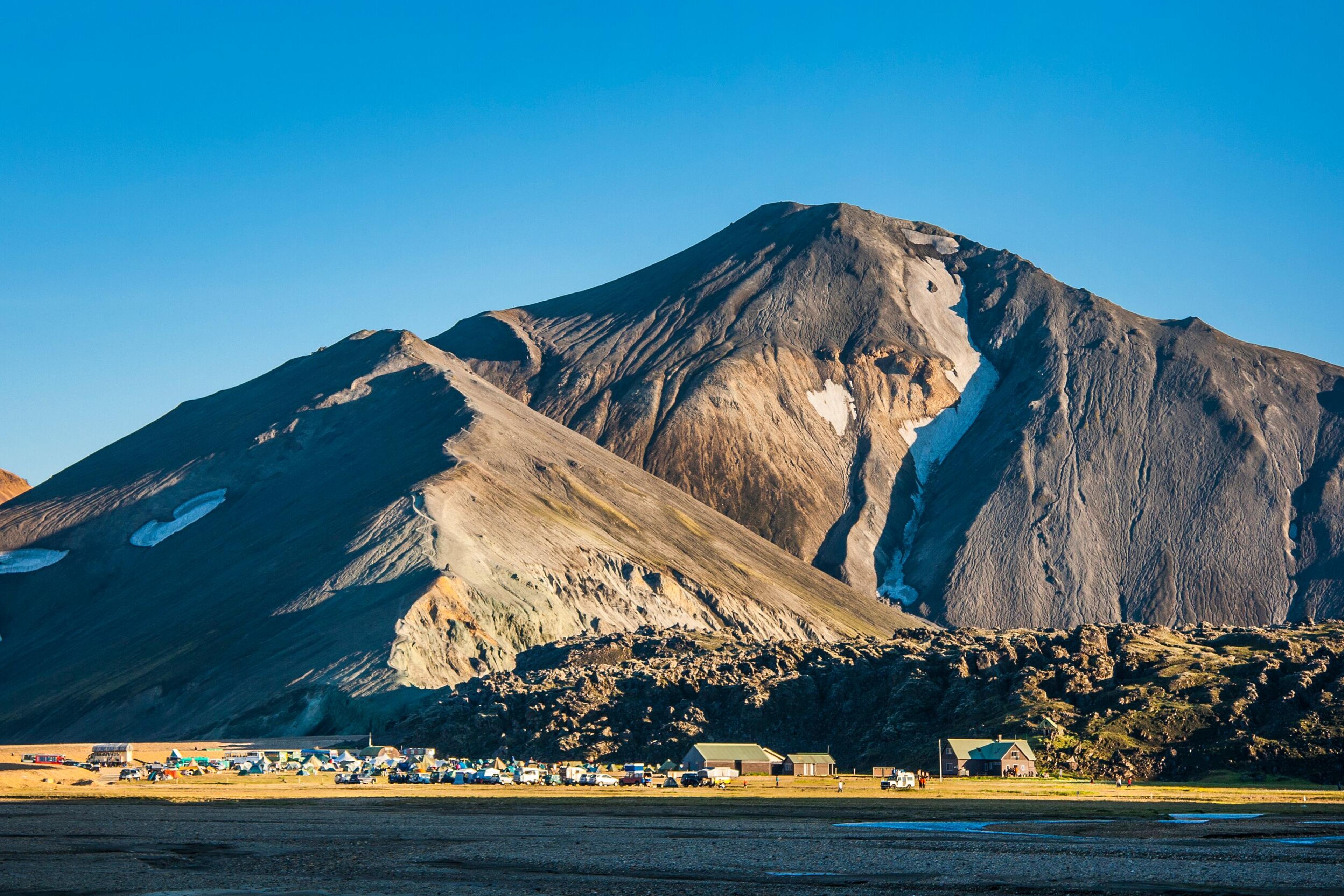 Bláhnúkur mountain on the background and Landmannalaugar campsite on the foreground. Highlands, Iceland 