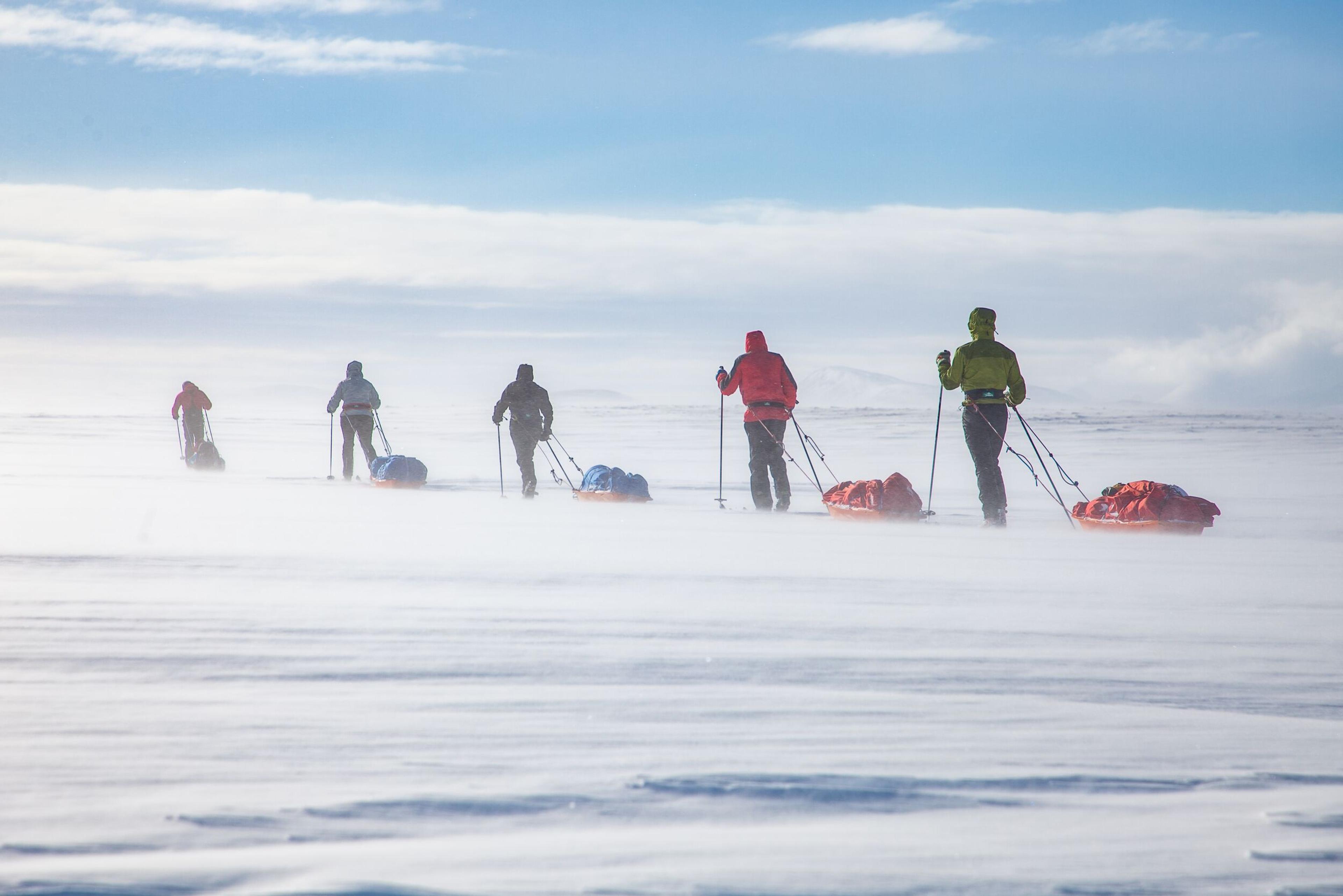A group of explorers traversing the Vatnajökull Glacier on skis