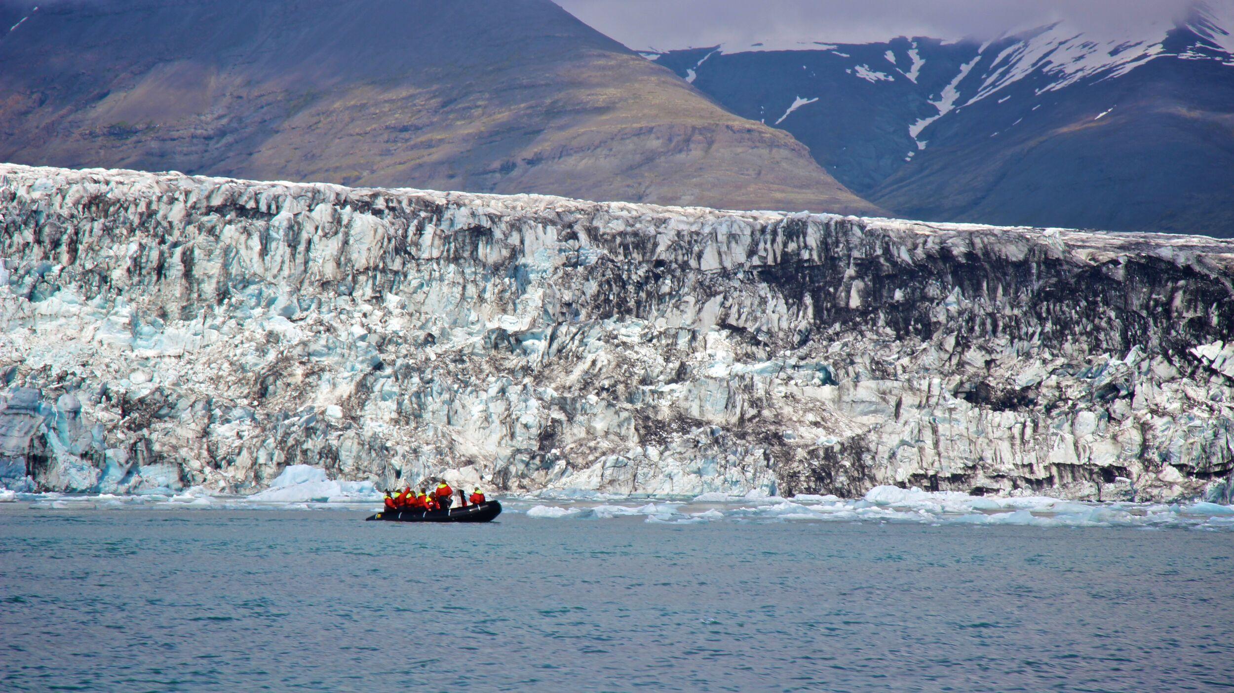 A boat sailing through the glacial lagoon in Iceland.