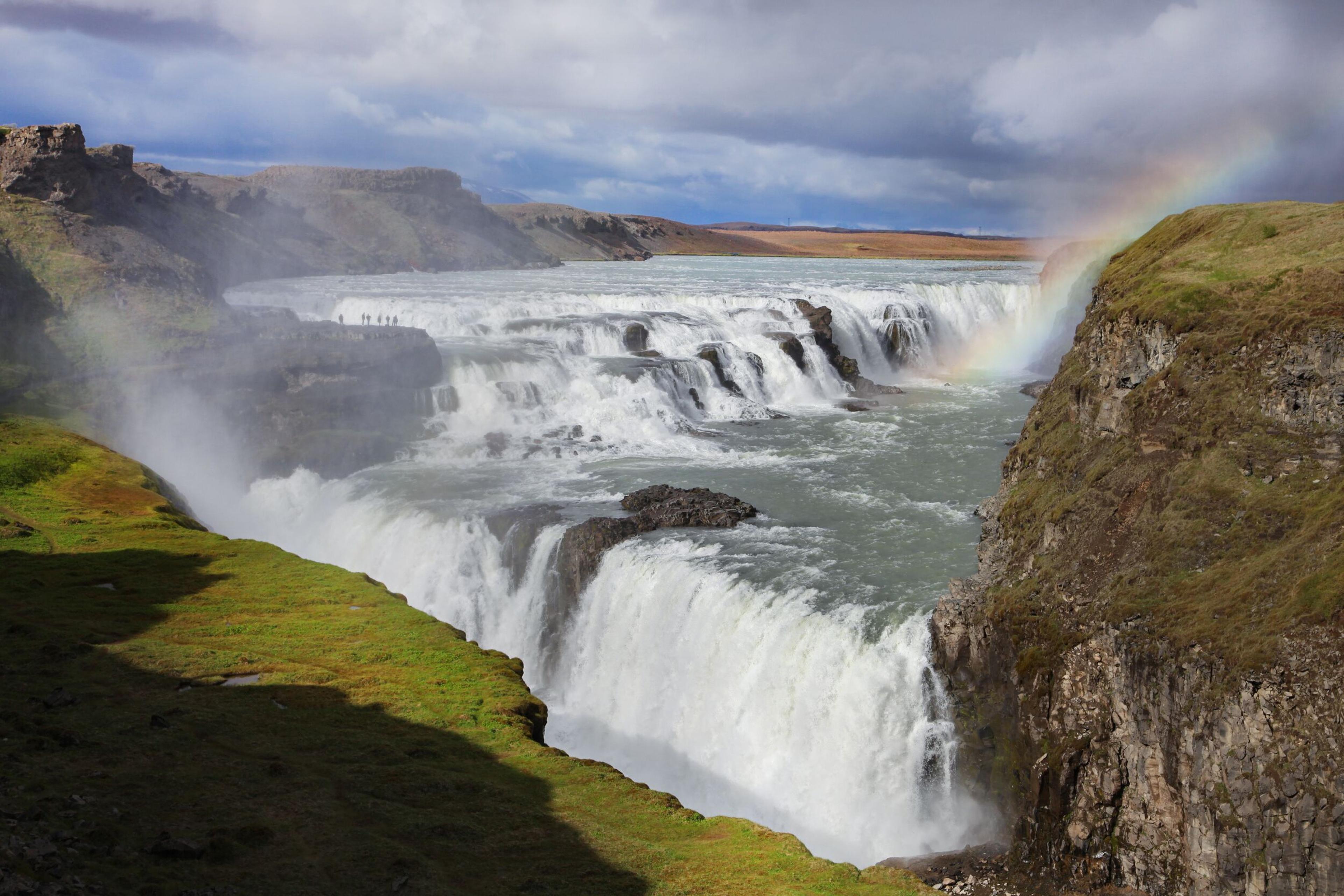 Gullfoss Waterfall and a striking rainbow in the icelandic golden circle.