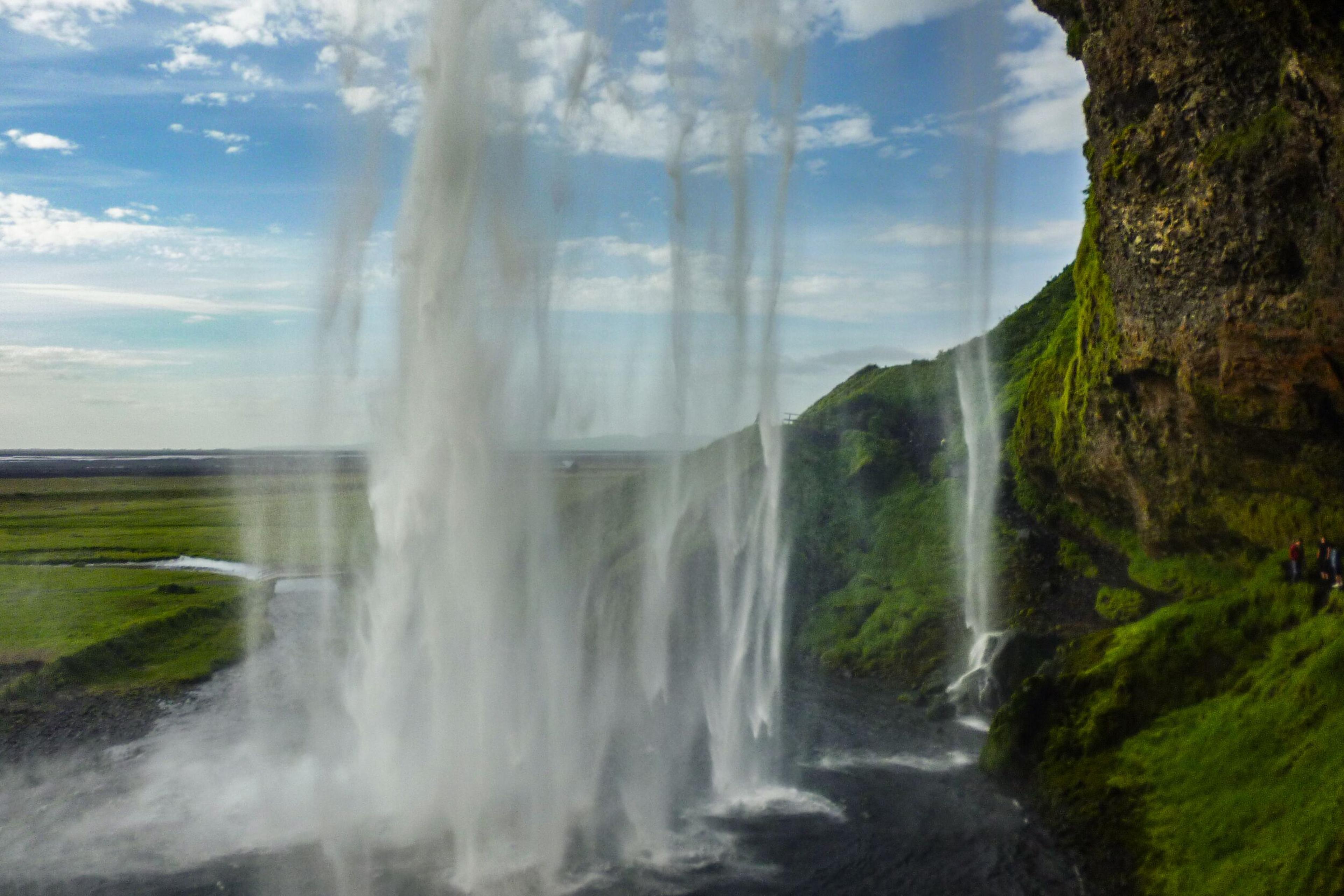 View behind Seljalandsfoss Waterfall, south coast of Iceland.