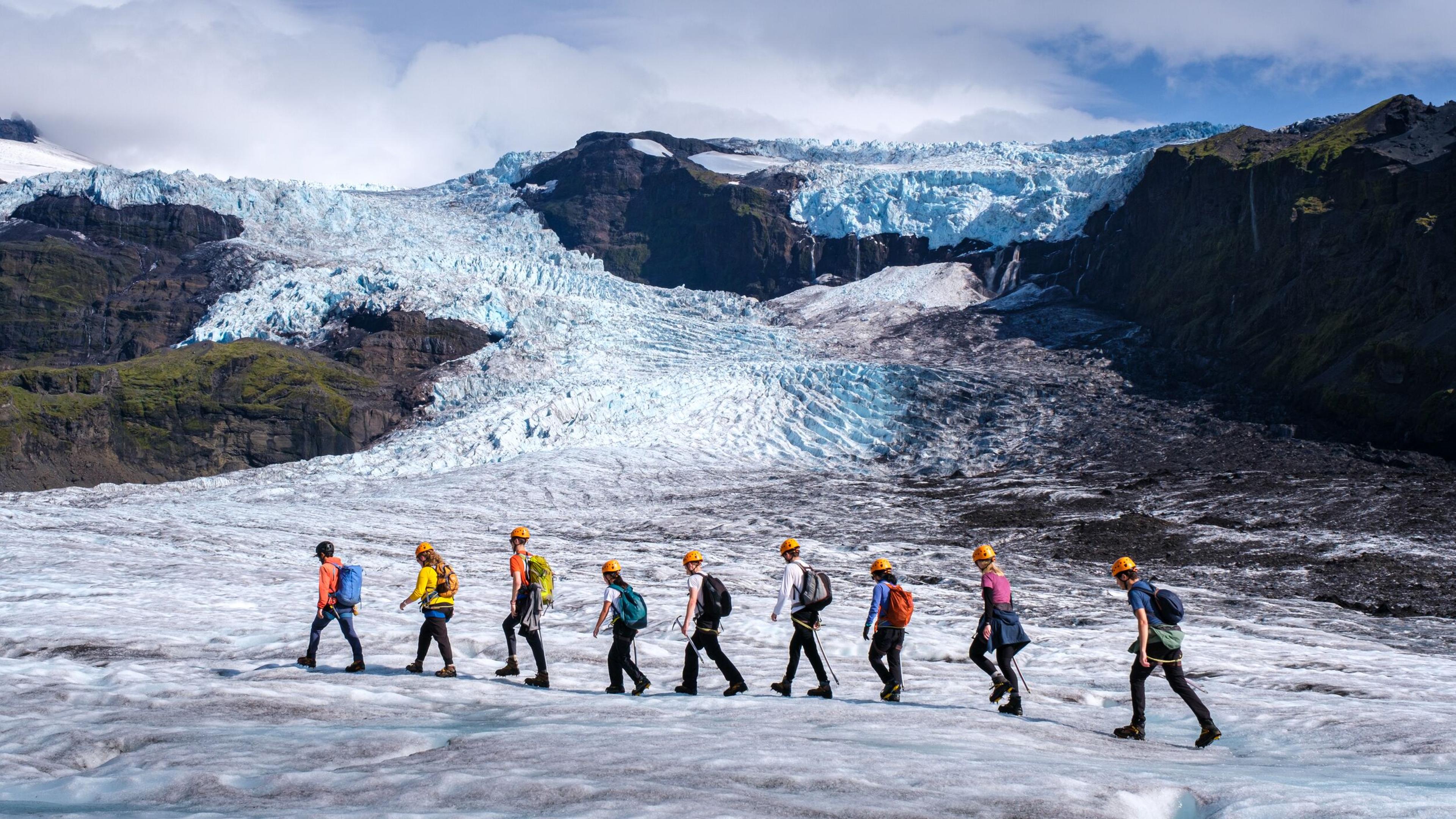 A group of people walking on the Skaftafell Glacier in Iceland,