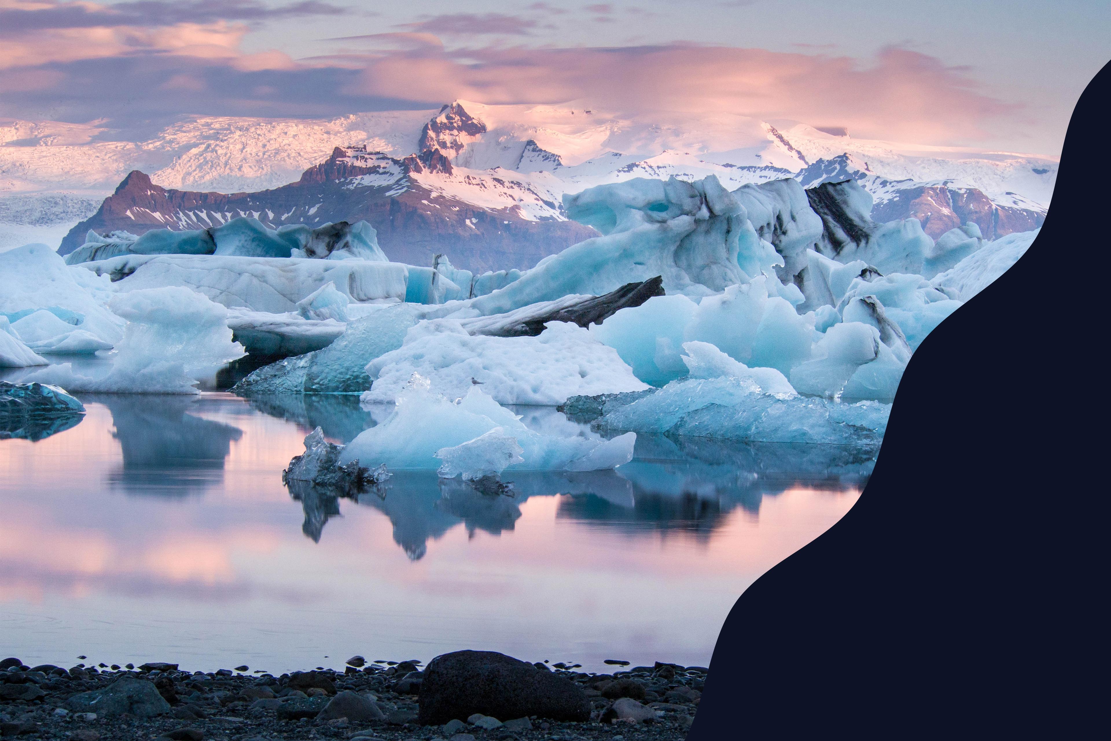 A landscape picture showing a glacier during a sunset.