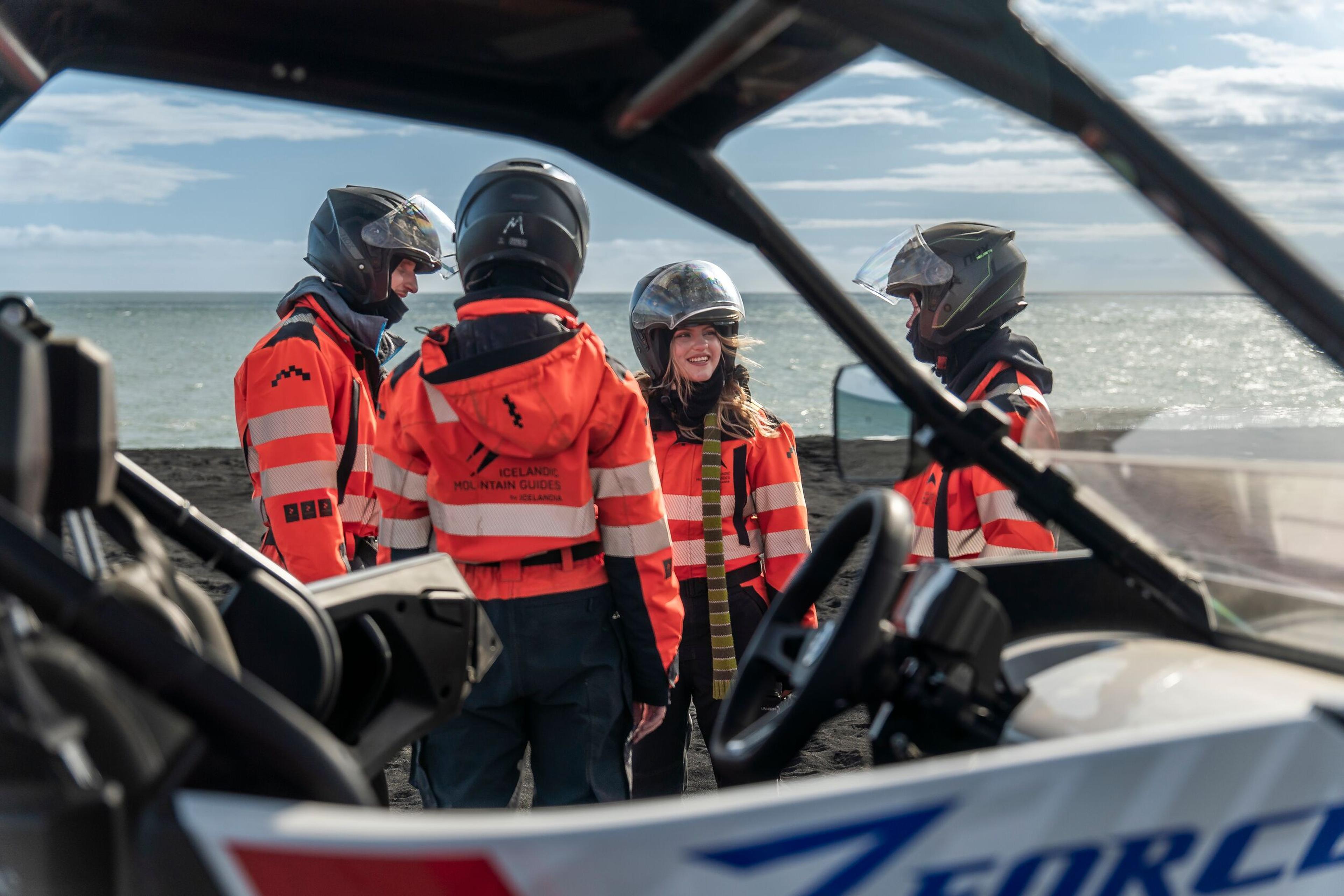A group of thrill-seekers receiving a safety briefing before embarking on their buggy tour in Iceland, showcasing the preparatory steps of the adventure.