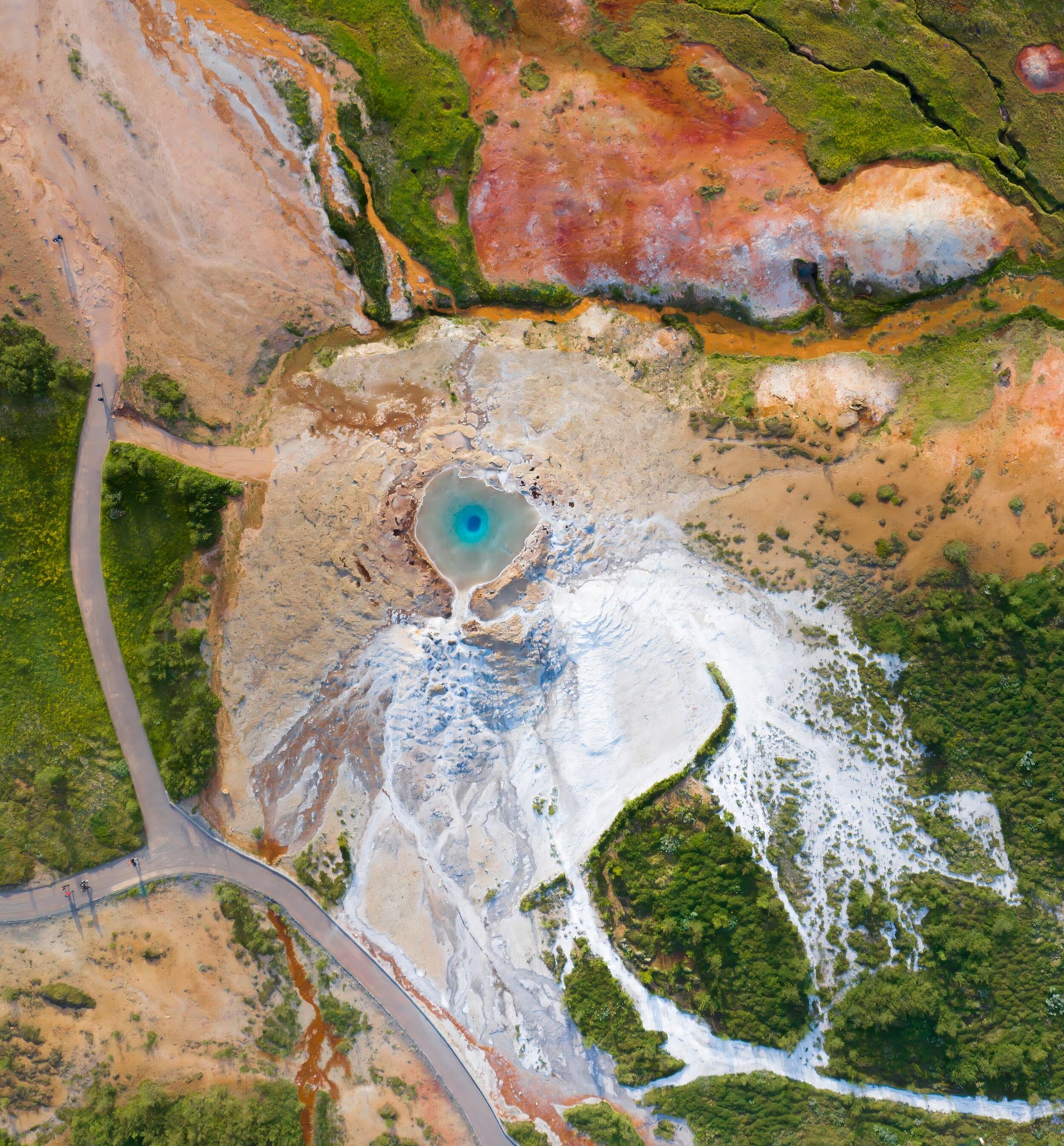 a couple taking a selfie at Geysir Geothermal area