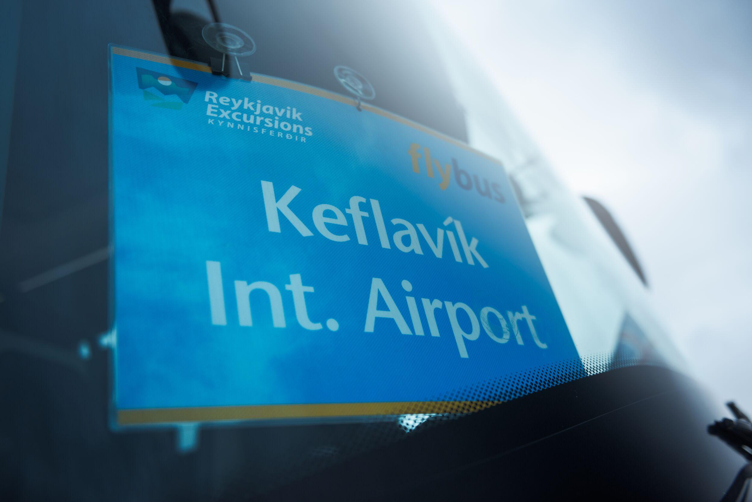 a sign on a bus reading "Keflavík International Airport".
