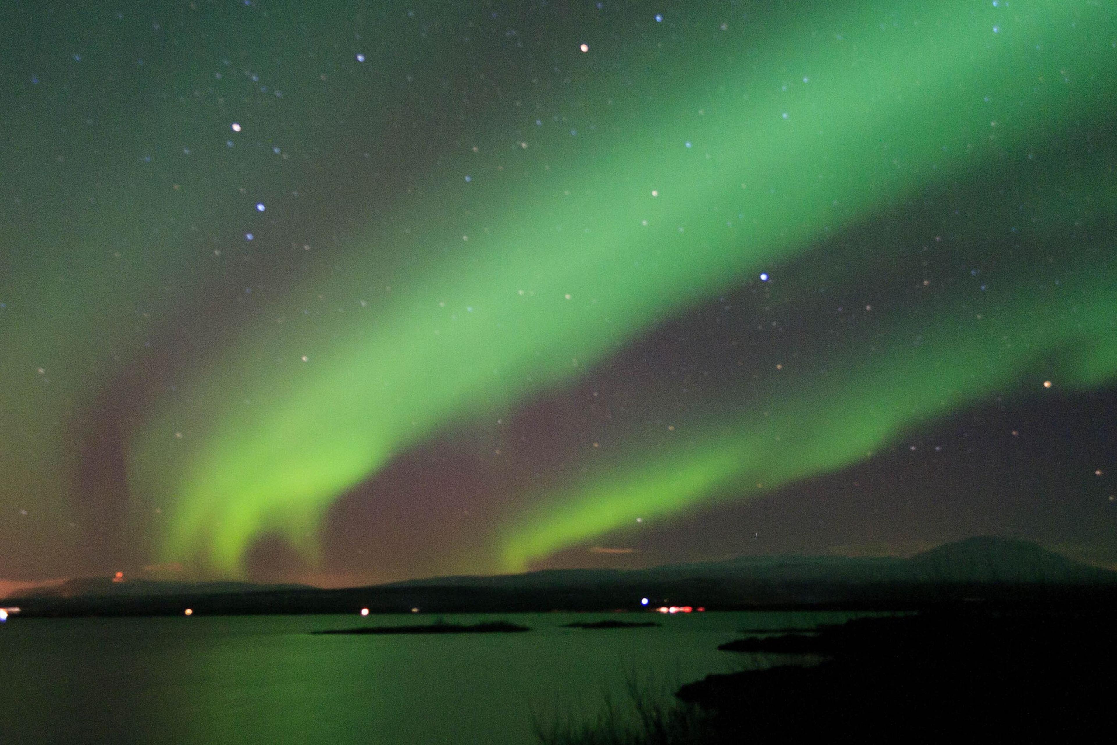 Northern lights over a lake in Iceland.