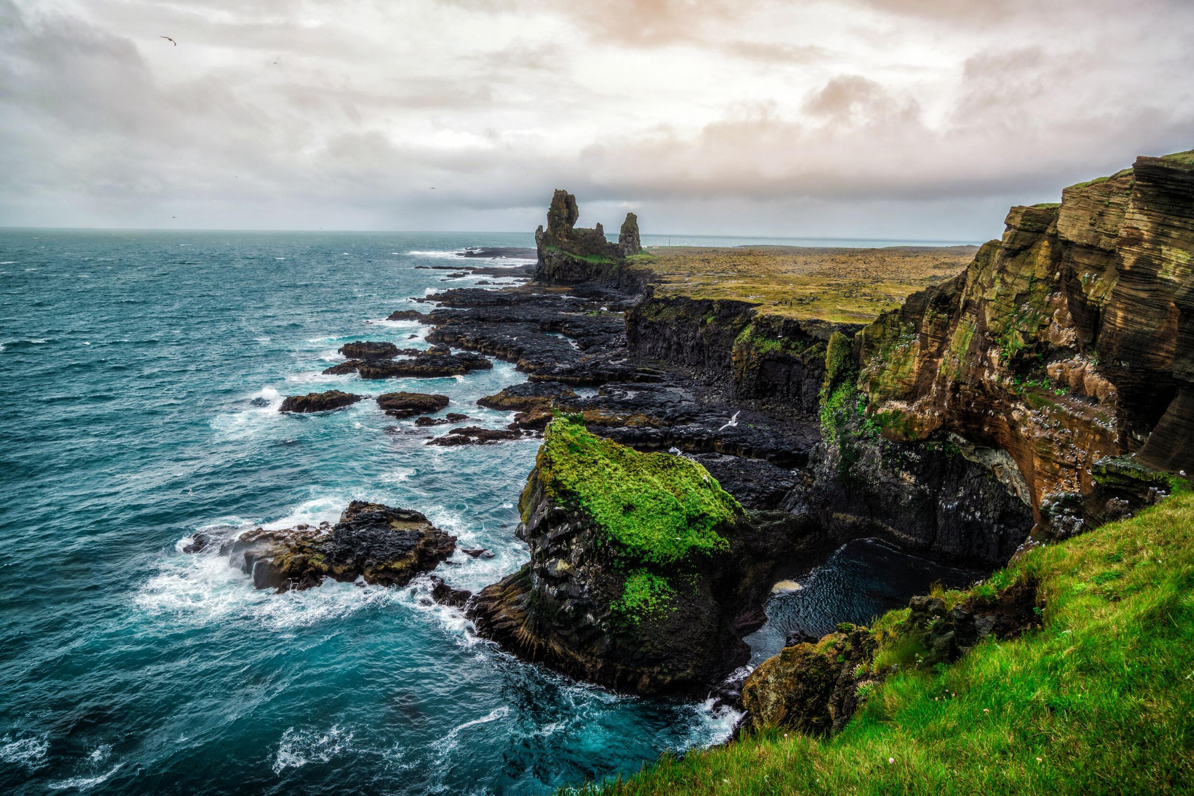 Majestic rock formations by the shore in Snæfellsnes peninsula, Iceland.