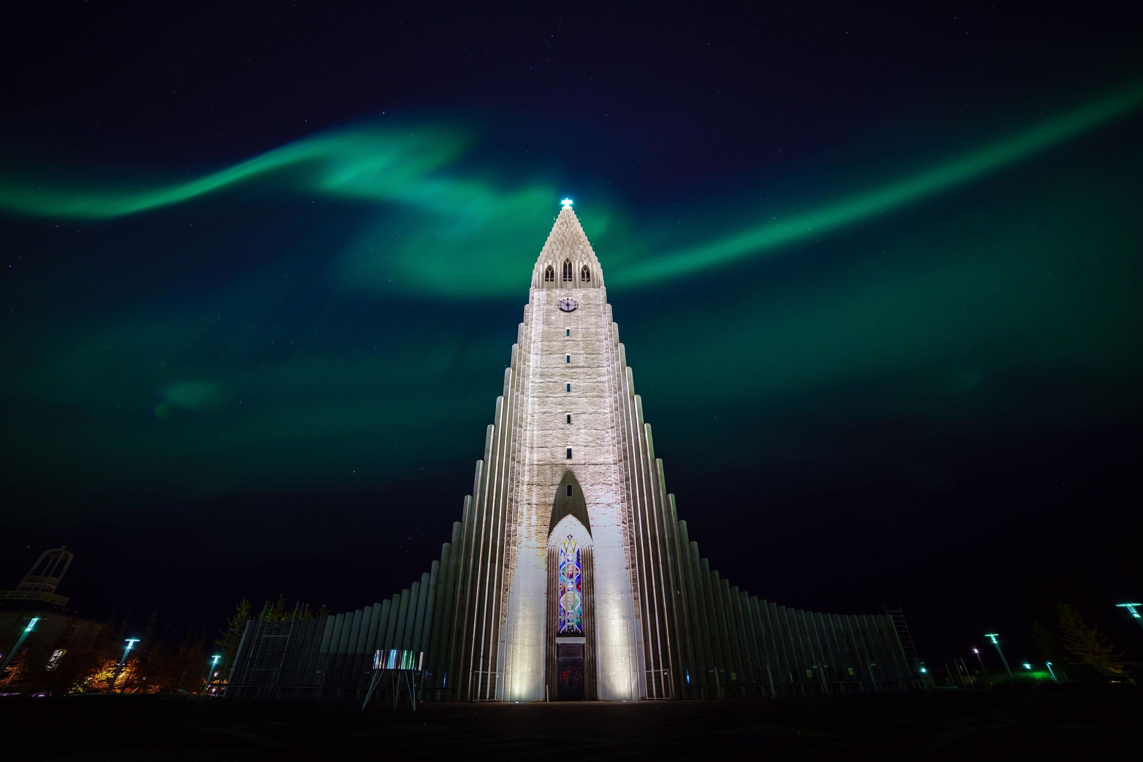 Hallgrímskirkja church under the Northern Lights in Reykjavik, Iceland.