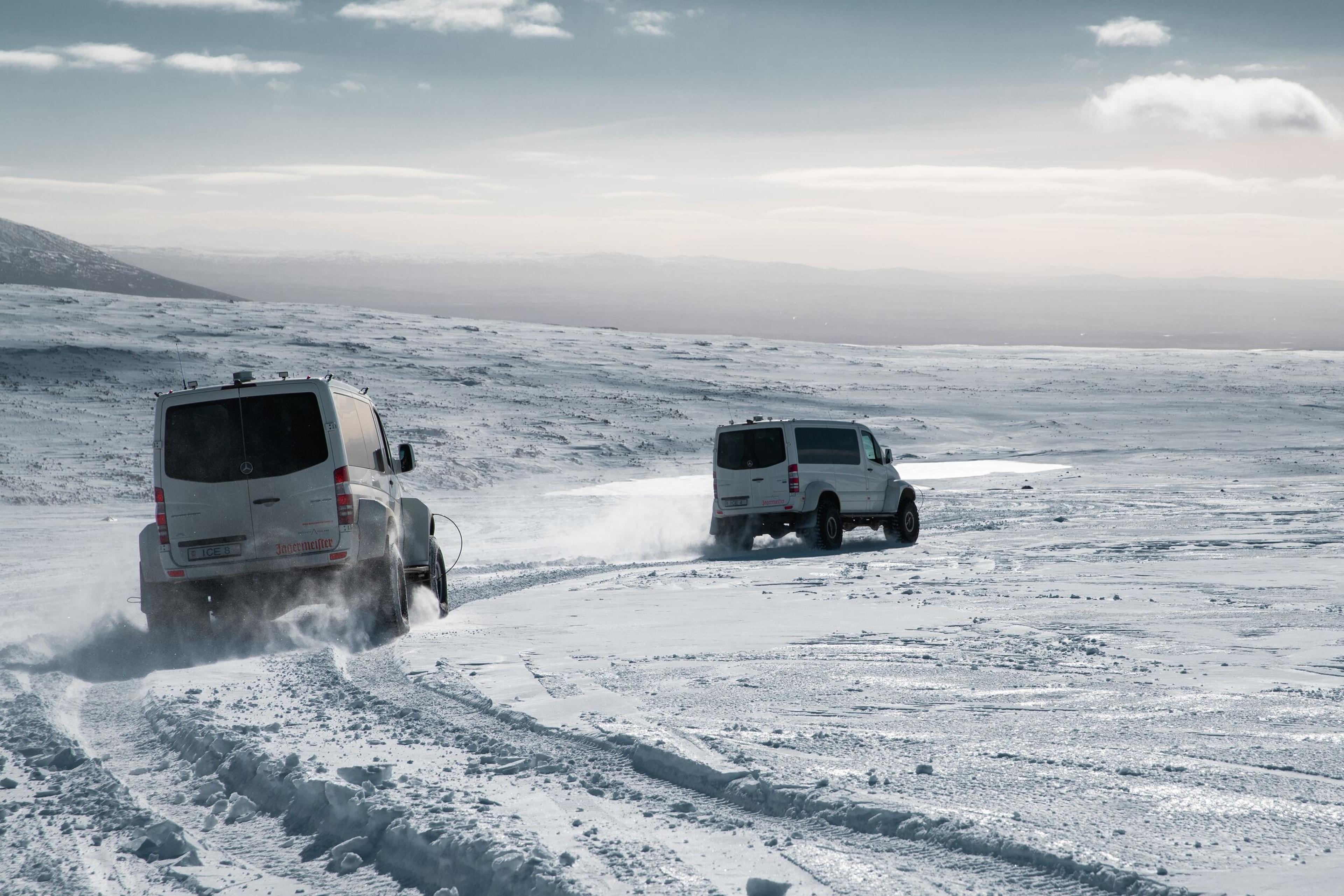 Two super-jeeps driving on a glacier in Iceland