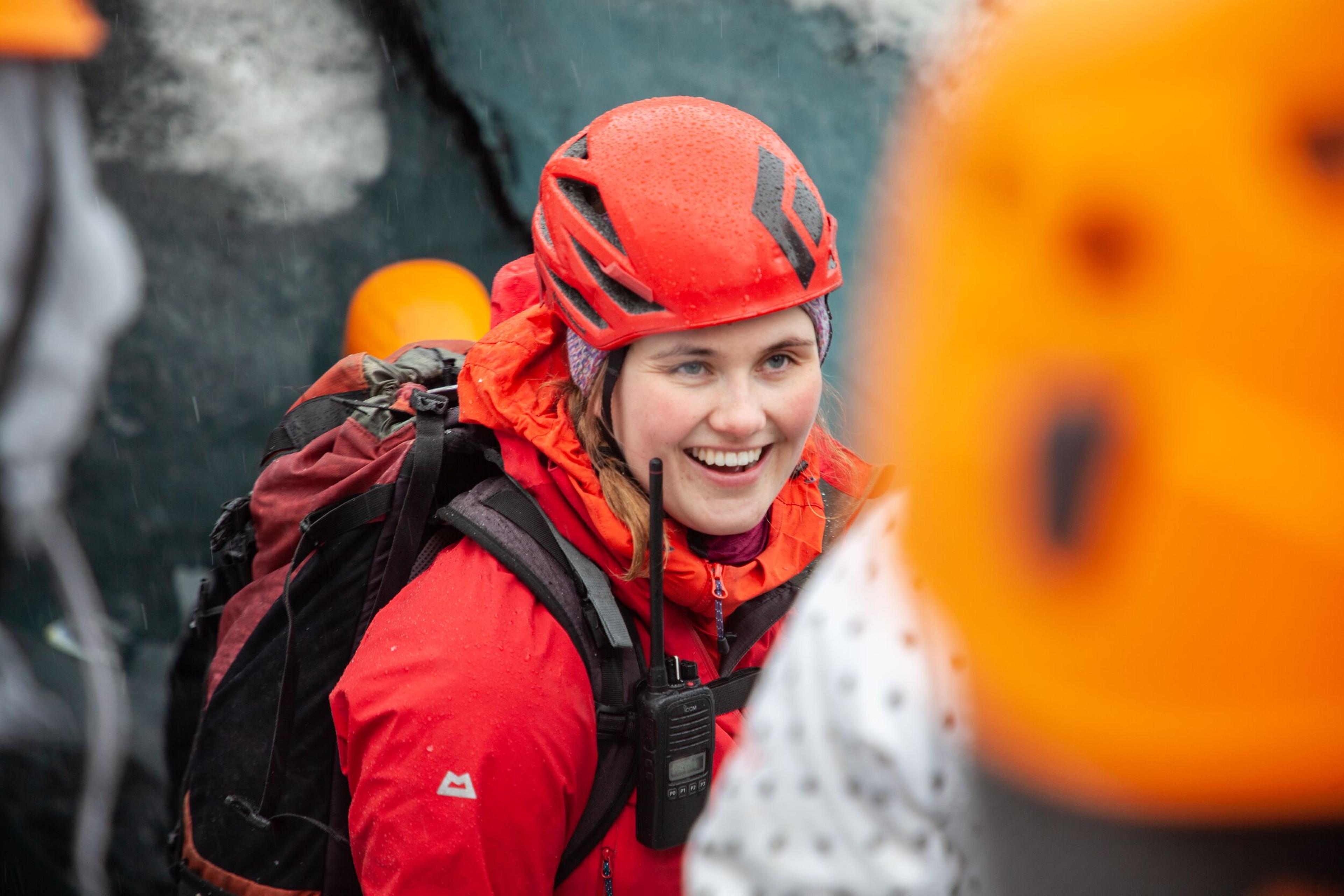 A glacier guide leading a group of tourists on the Sólheimajökull glacier in the south coast of Iceland.