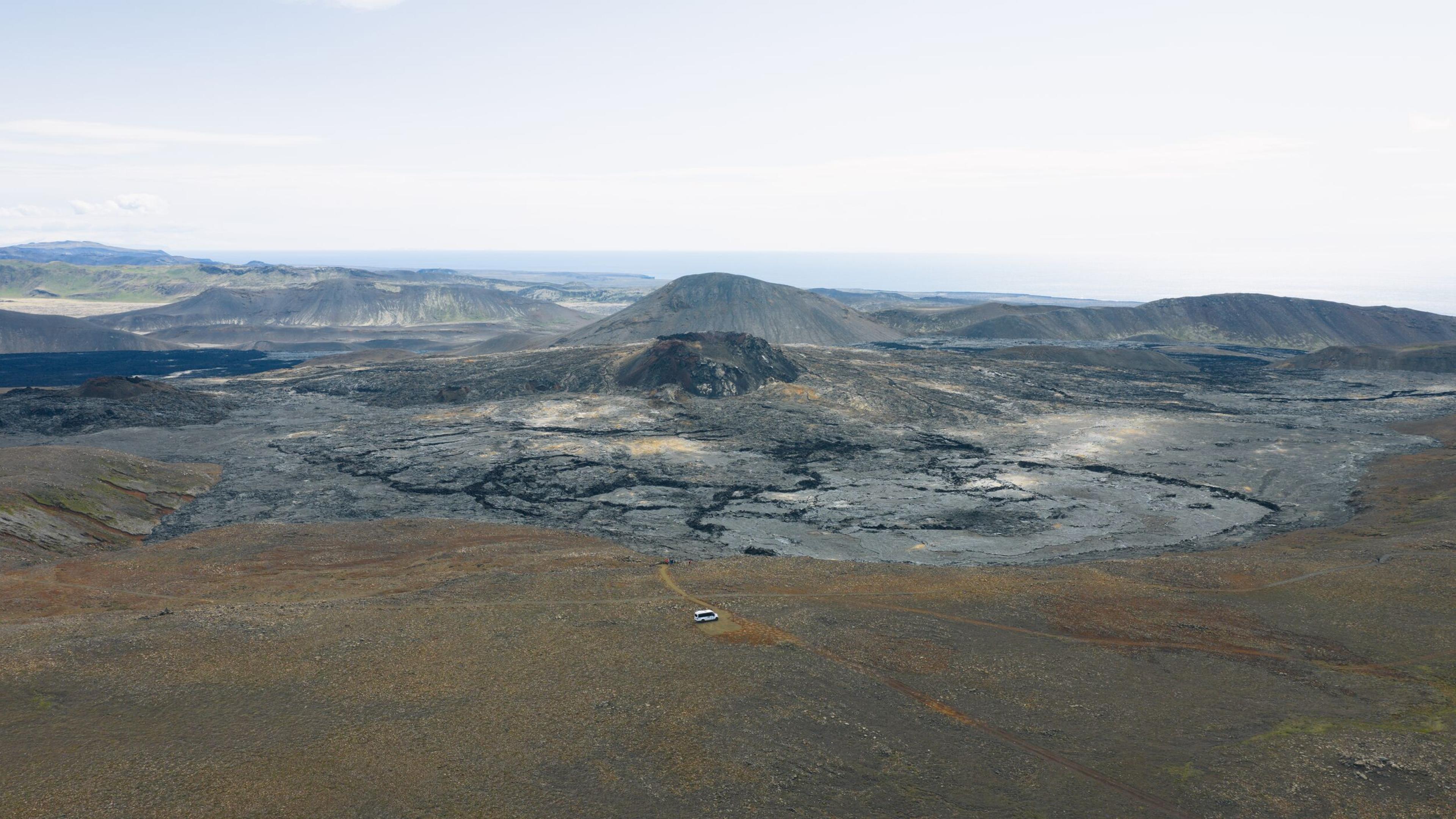 an aerial view of a volcano in the middle of a desert .