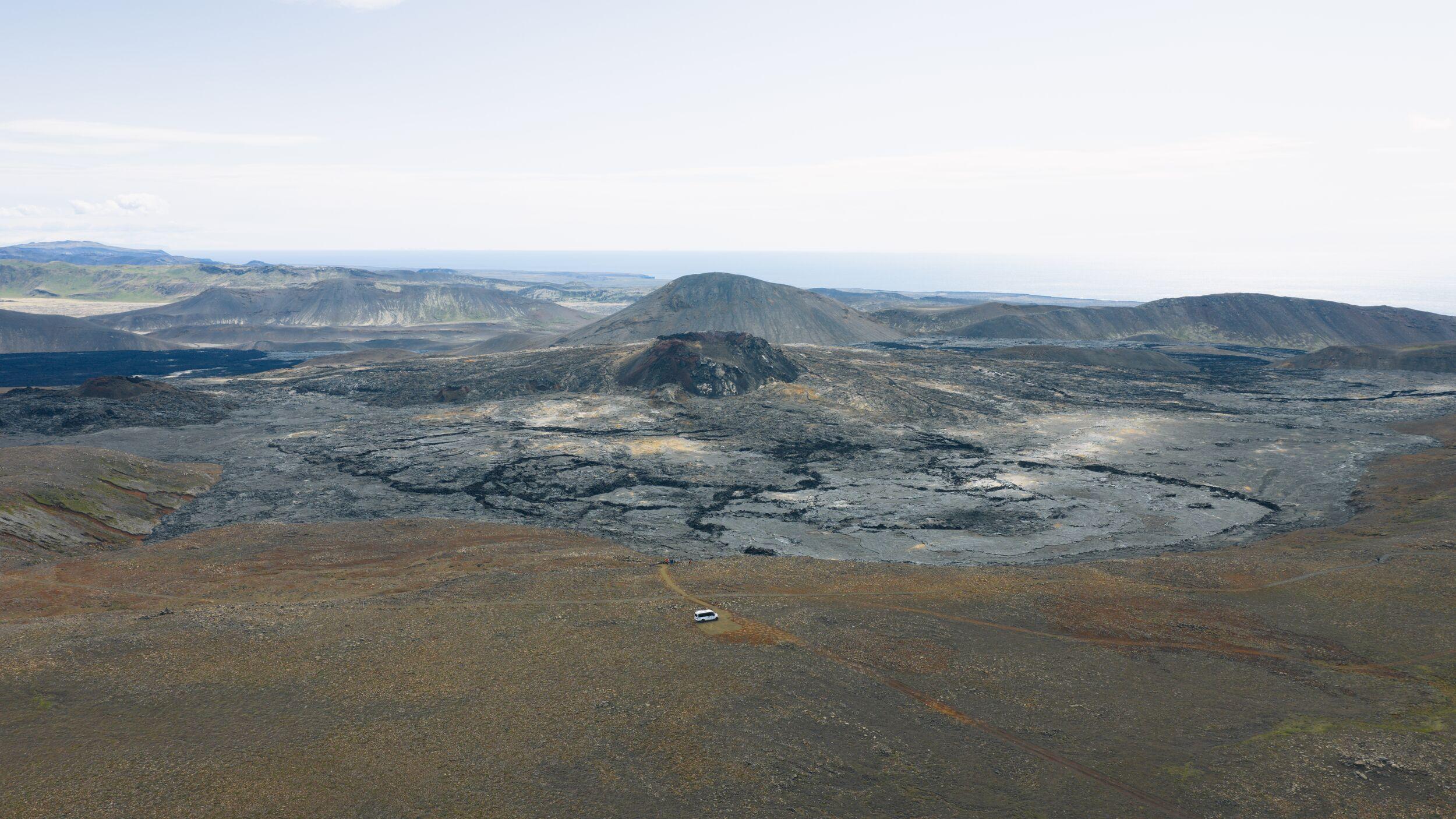 an aerial view of a volcano in the middle of a desert .