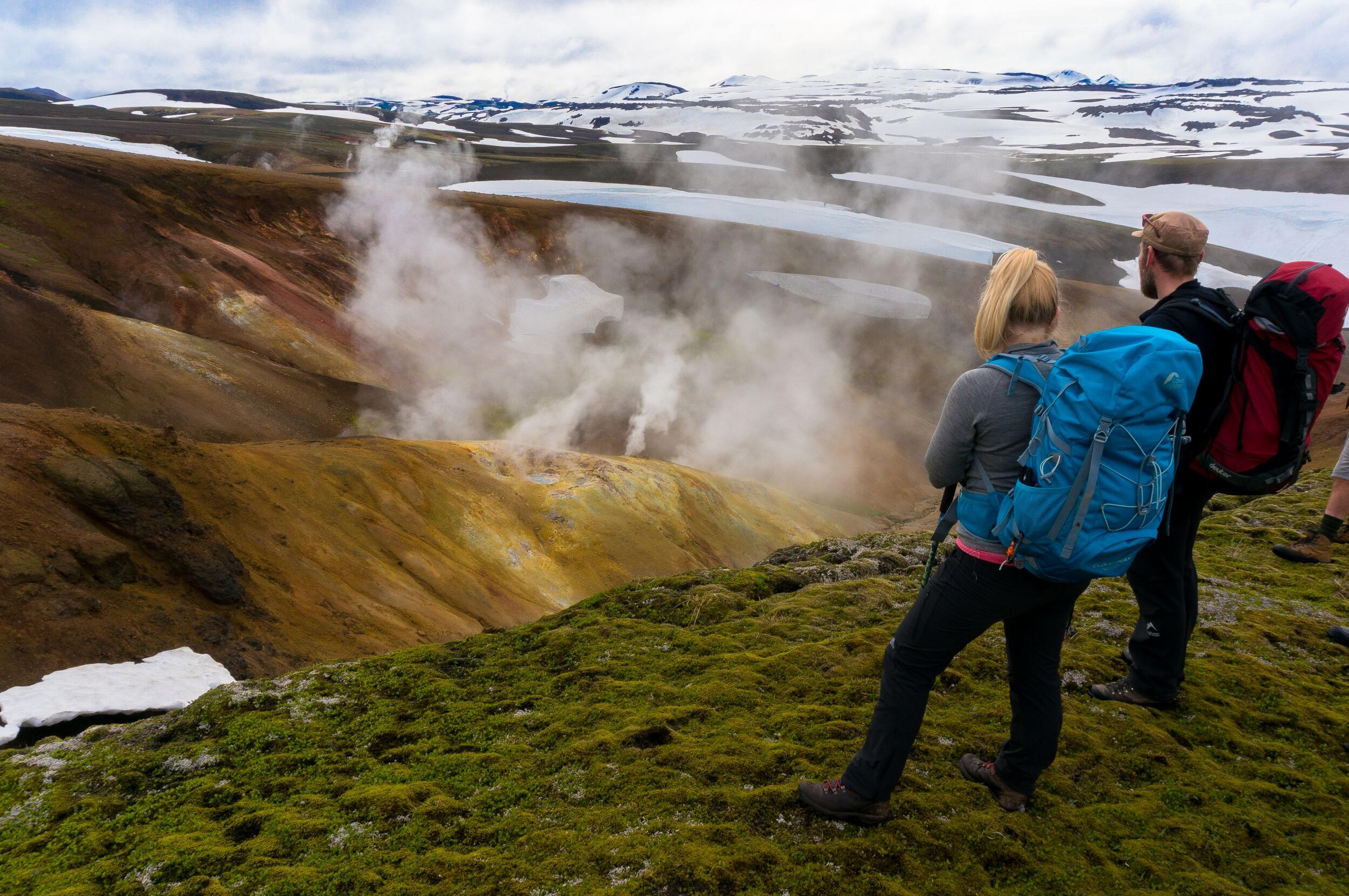 Two people looking over geothermal area