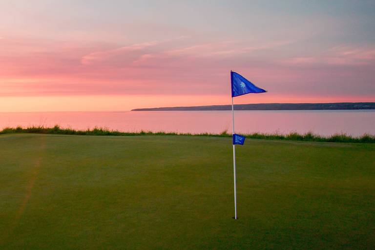 blue burgee flag at sunset
