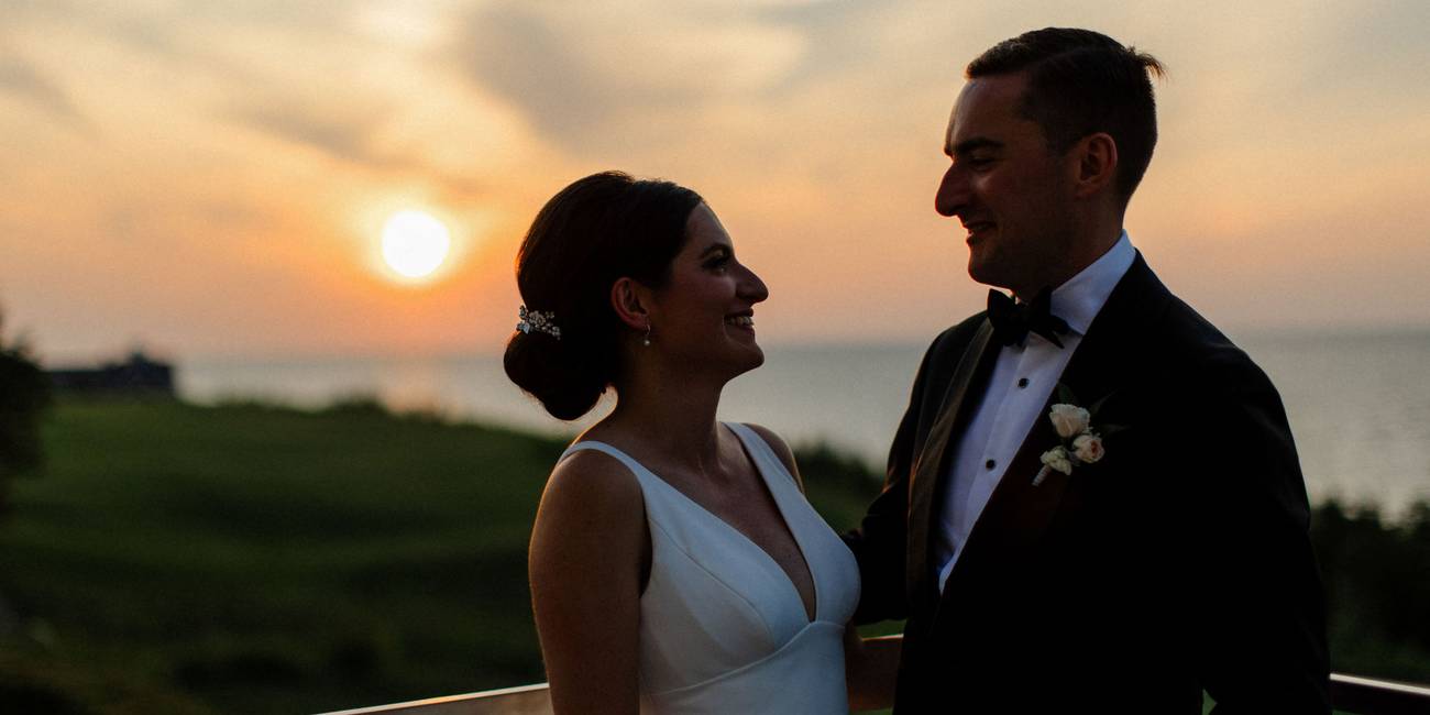 Newlyweds smile at sunset, Bay Harbor Golf Club