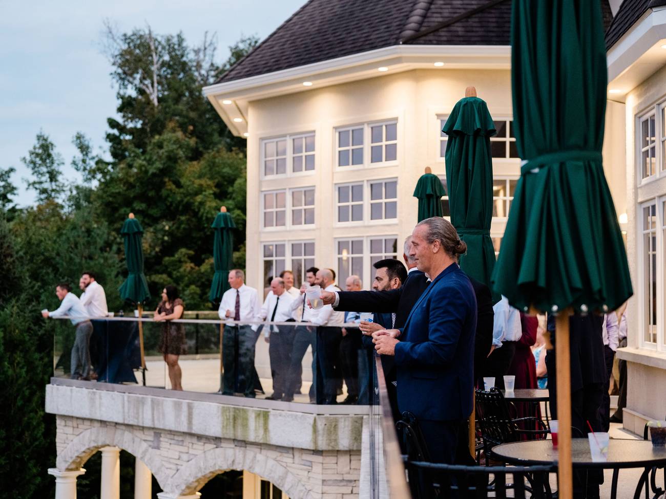 Party guests enjoy Bay Harbor Golf Club outdoor terrace