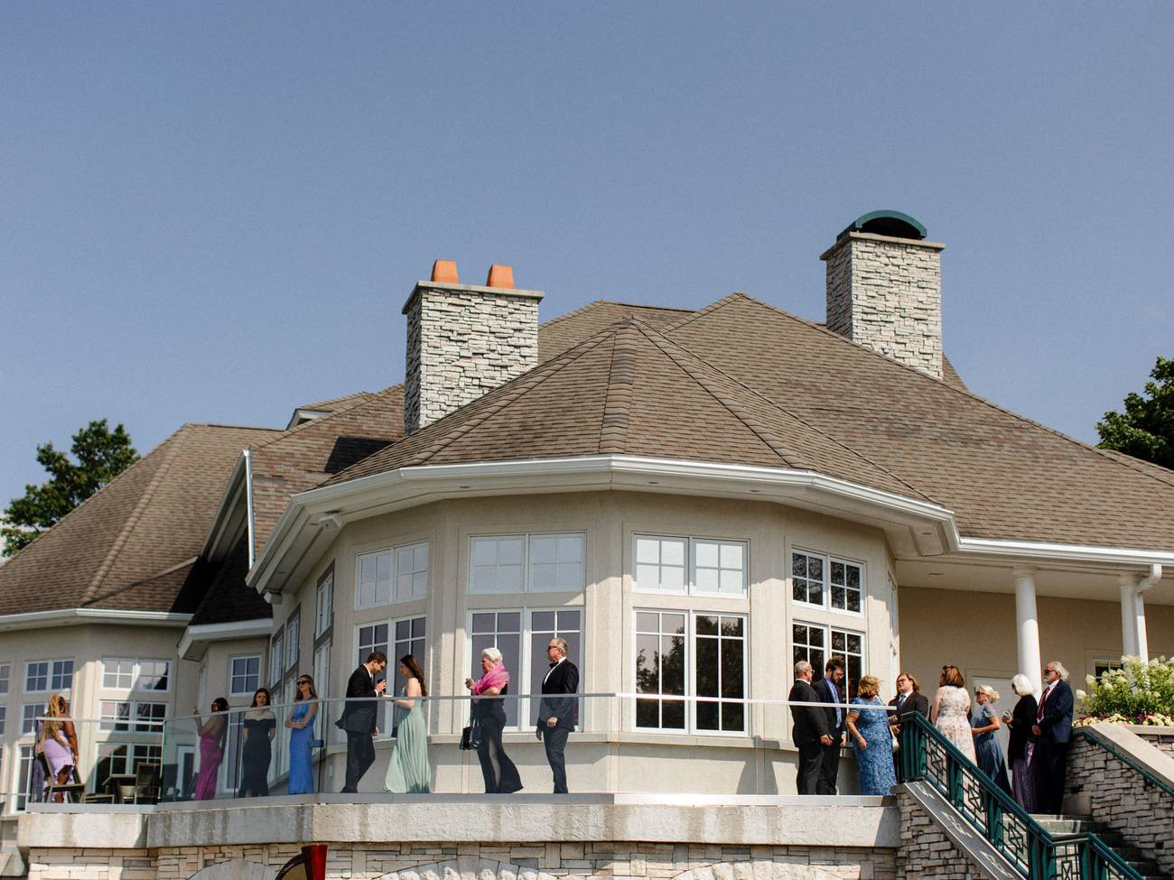 Guests enjoy glass-railing terrace, Bay Harbor Golf Club