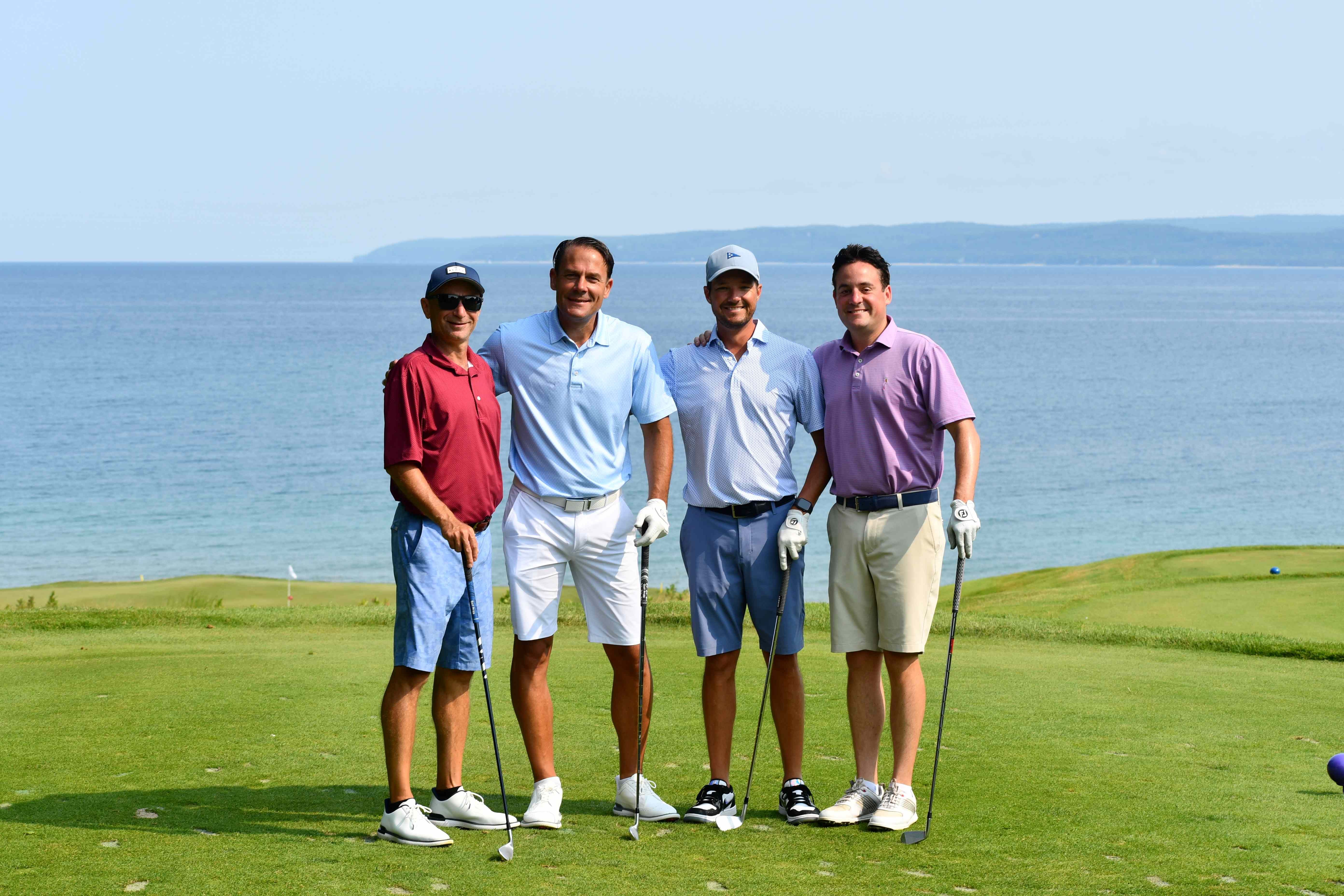 golfers on course in front of Lake Michigan