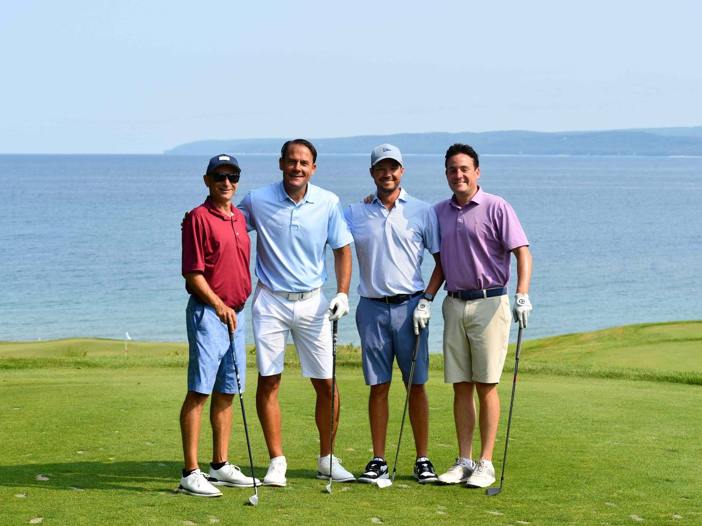 golfers on course in front of Lake Michigan