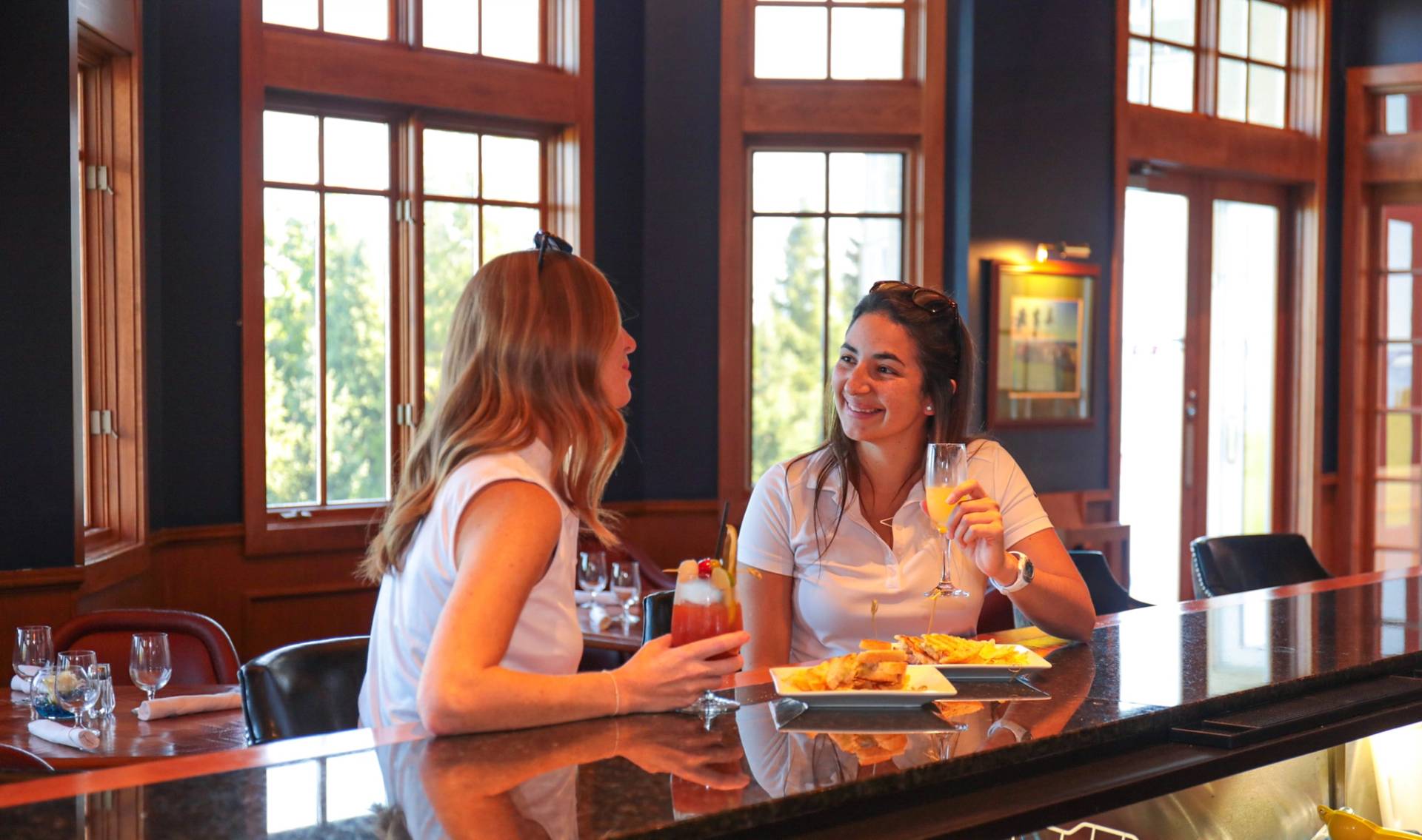 Ladies smiling at Bar