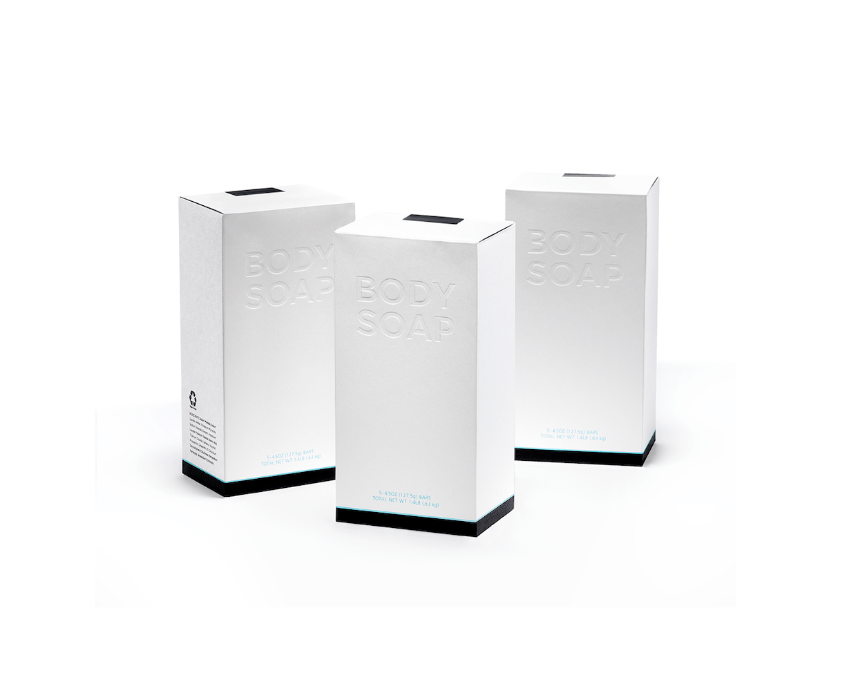 Three plain white rectangular paper boxes that read “Body Soap” in embossed lettering