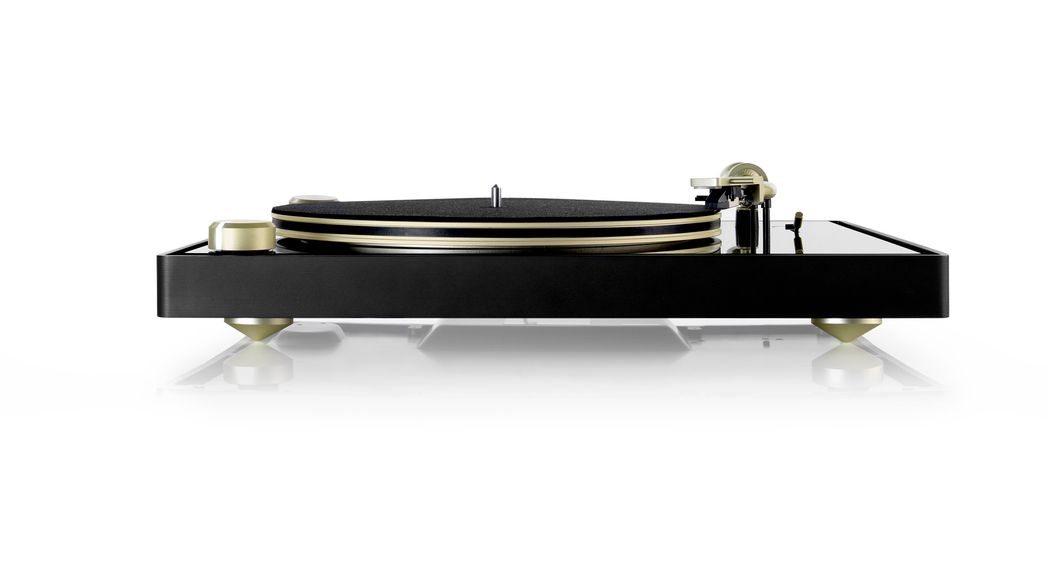 Black record player with a gold needle arm and other gold hardware