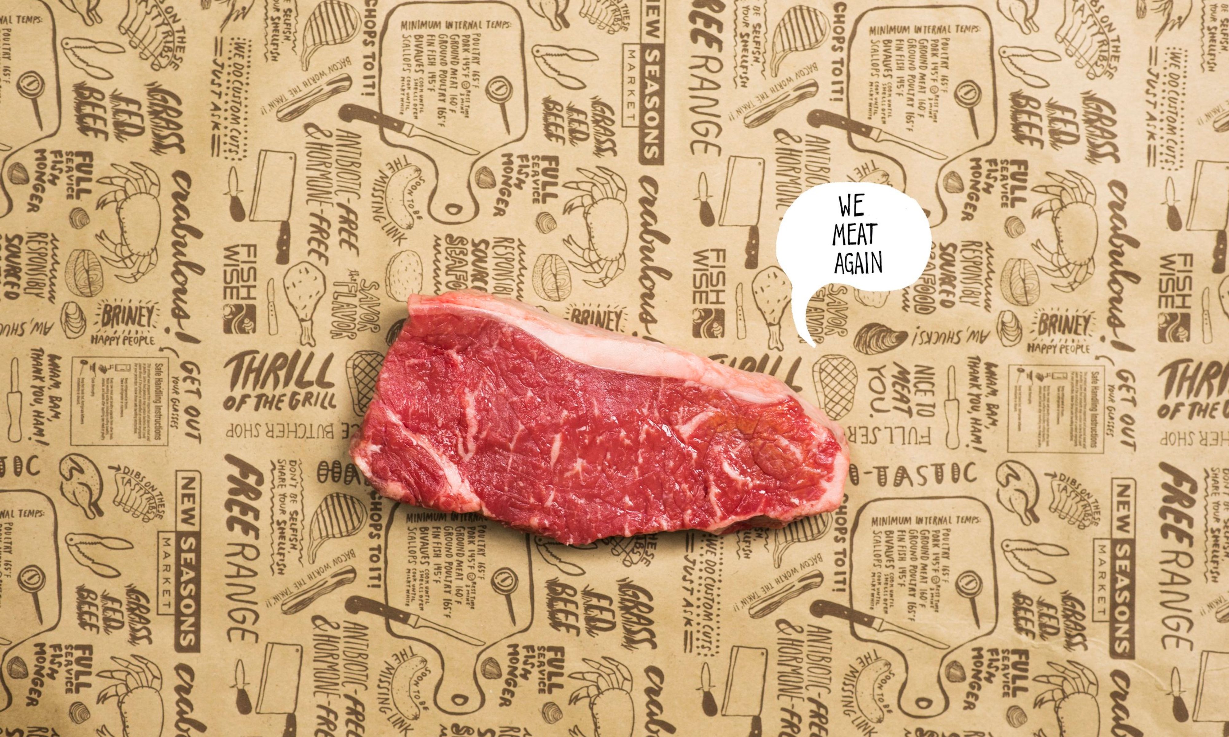 A cut of steak sitting on brown paper with several phrases and illustrations printed on it, with the text “We meat again” placed next to the steak in a speech bubble