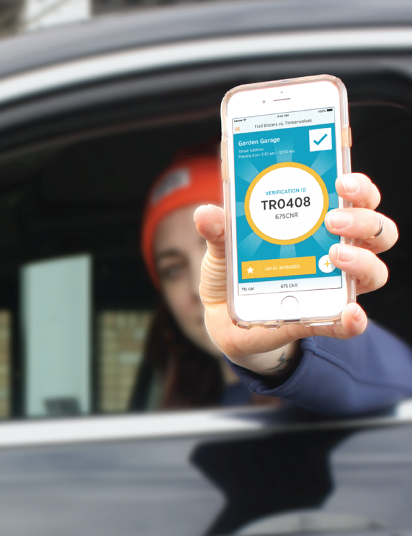 Person holding a mobile phone outwards showing a verification ID in the Citifyd app