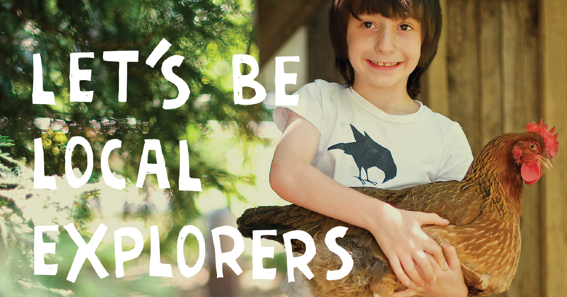 Child smiling and holding a chicken with the words “Let’s Be Local Explorers” in a hand-drawn font next to them