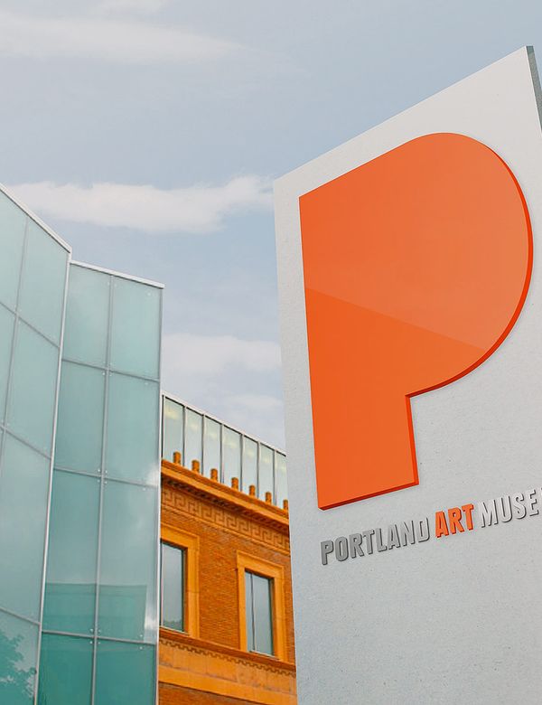 Portland Art Museum signage featuring a large, orange stylized P in front of the museum