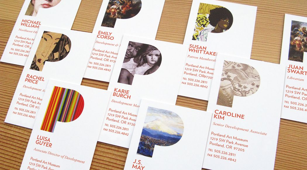 Several business cards for Portland Art Museum employees that feature art placed within a stylized P cutout