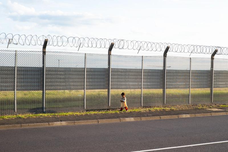 Lone child by the runway