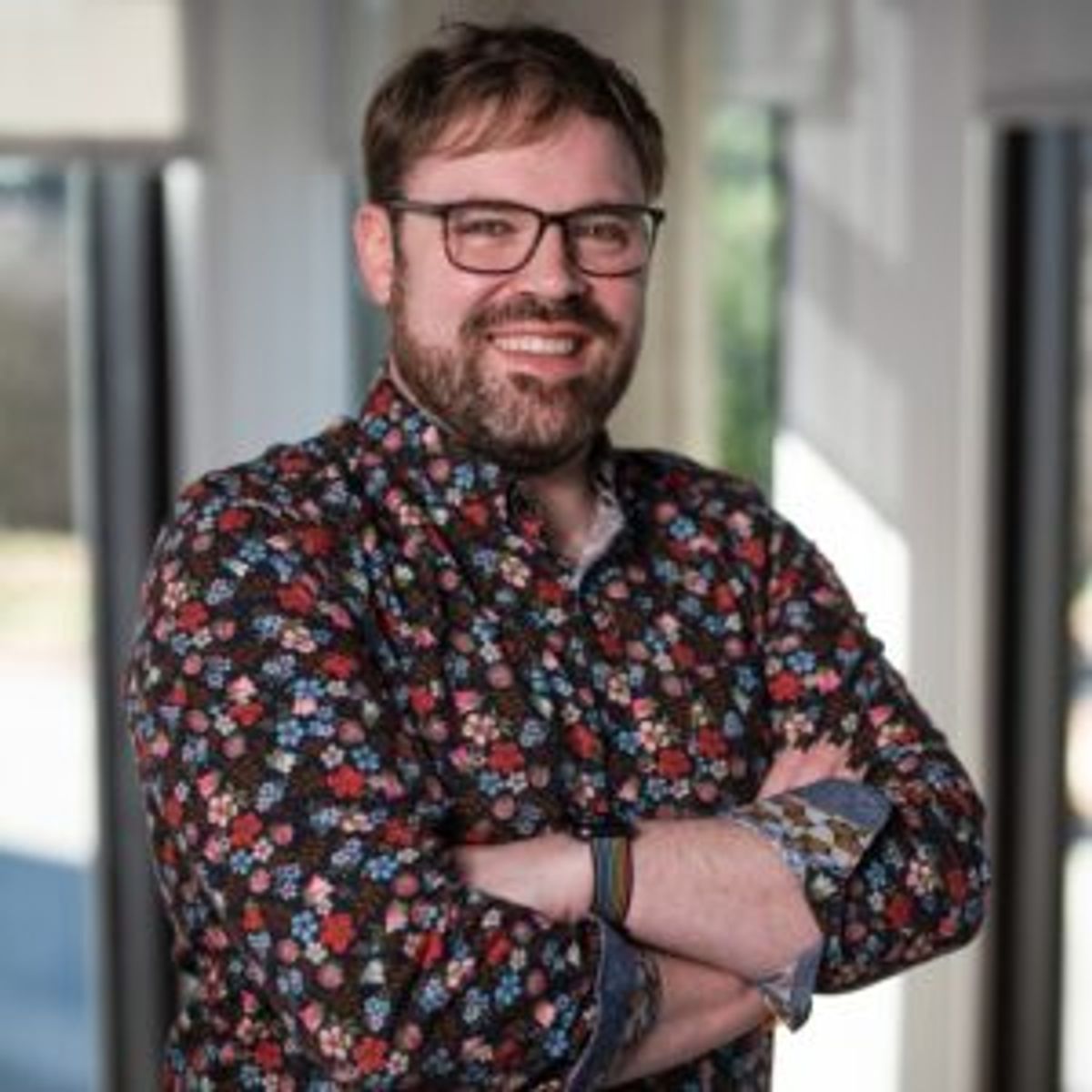 Headshot of Justin Hester, the speaker of the event.