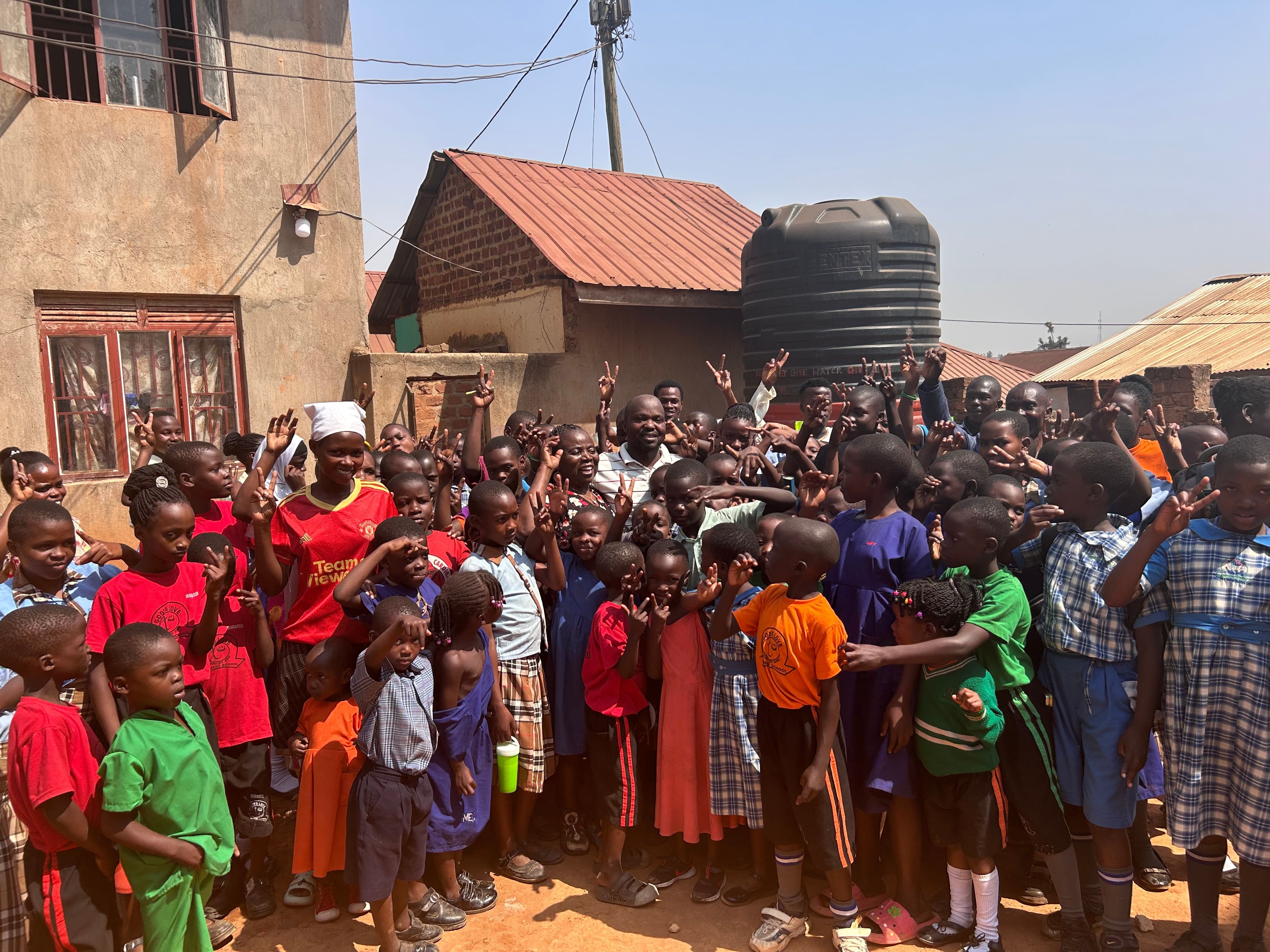 Community members celebrating a completed water project.