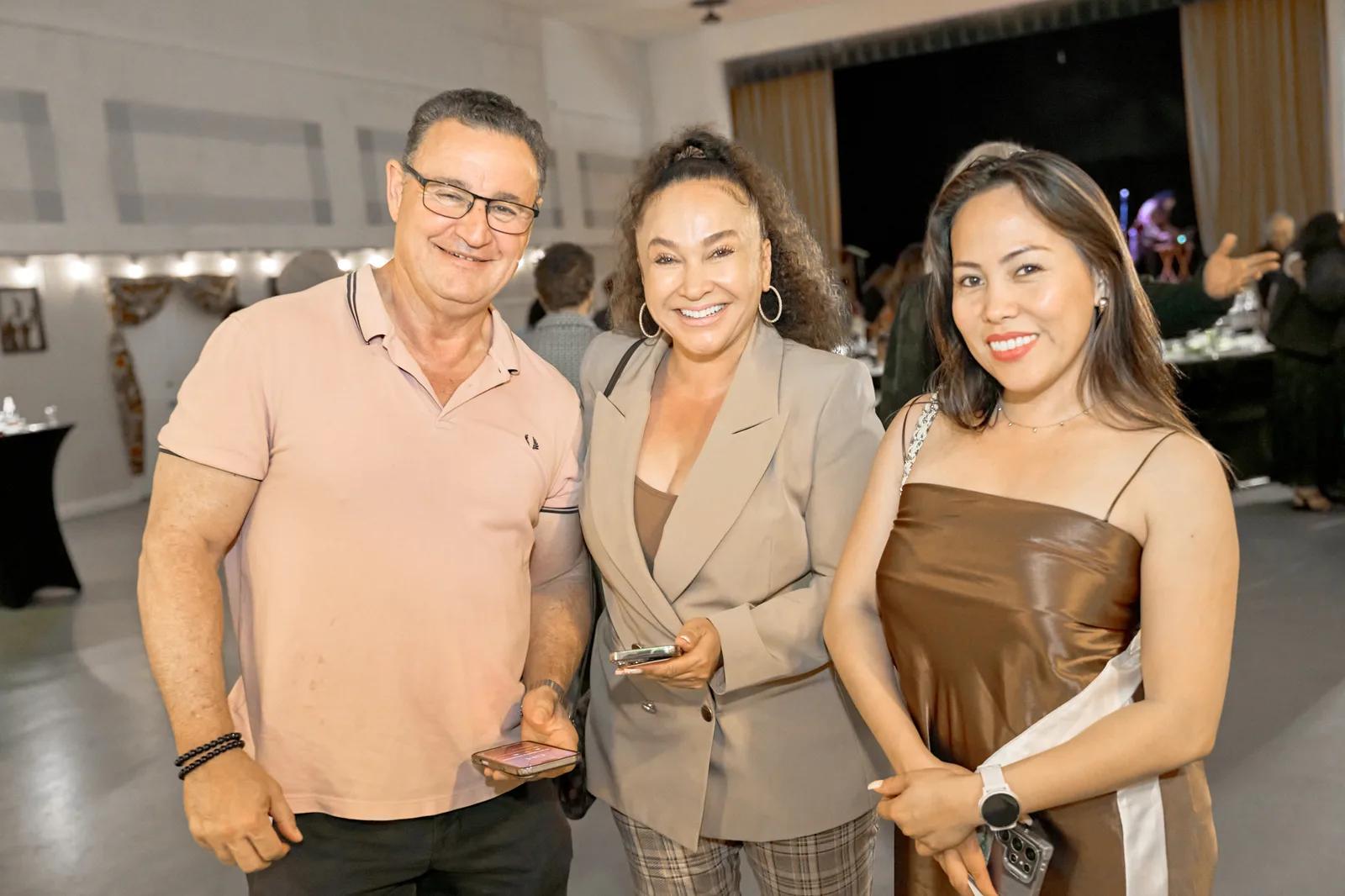 Three guests gathered together at the Gala.