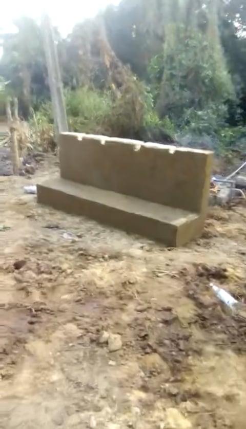 A newly constructed wall and basin for the water taps.
