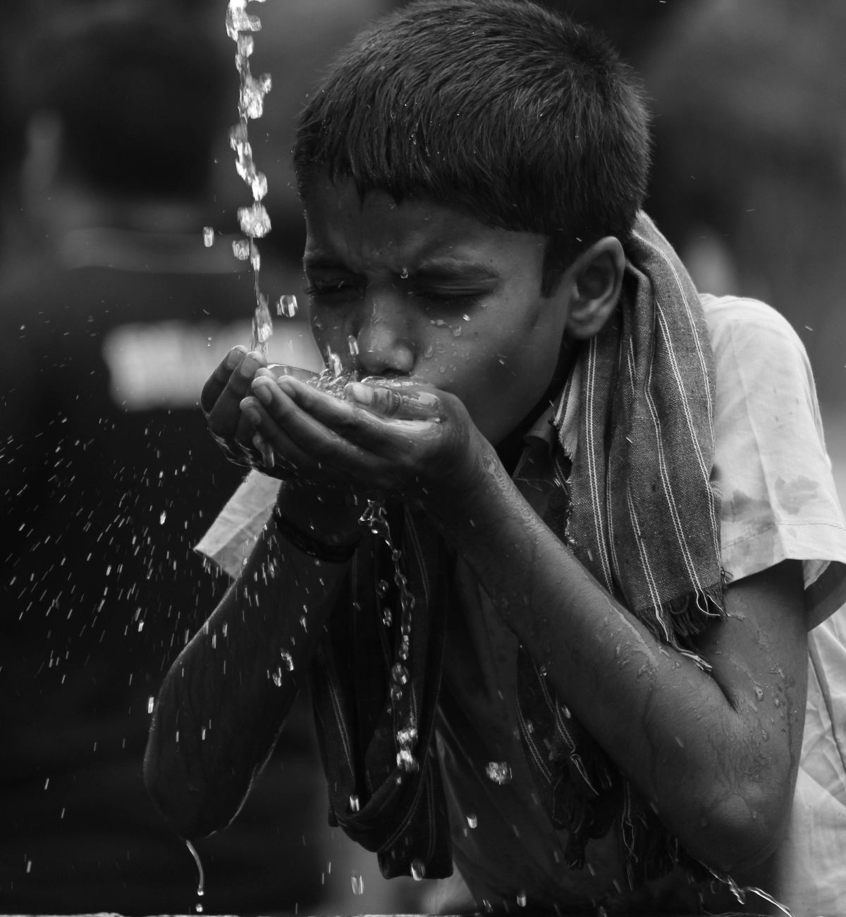 Boy drinking fresh water