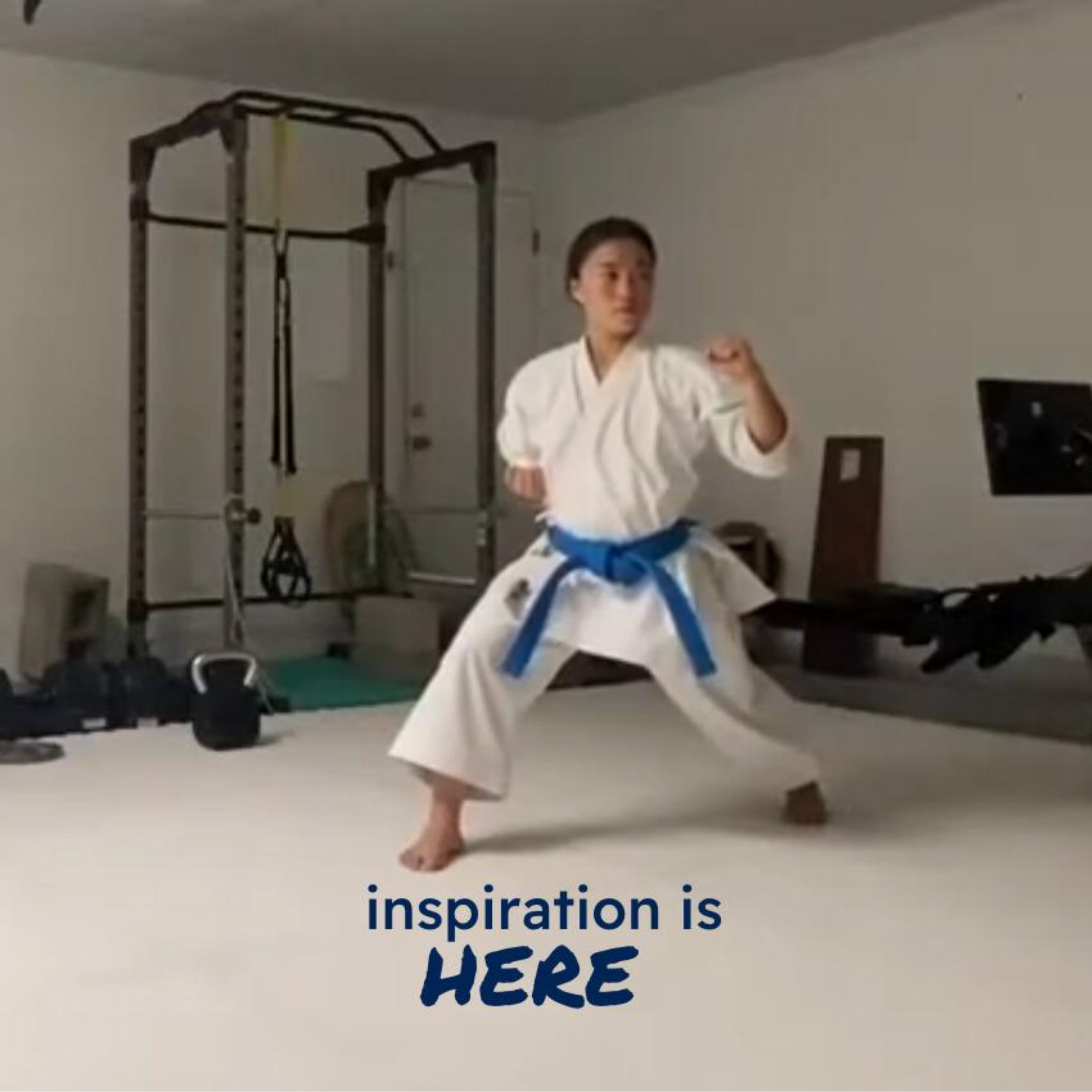 A karate athlete practices a stance in a home gym, with the caption "inspiration is here."