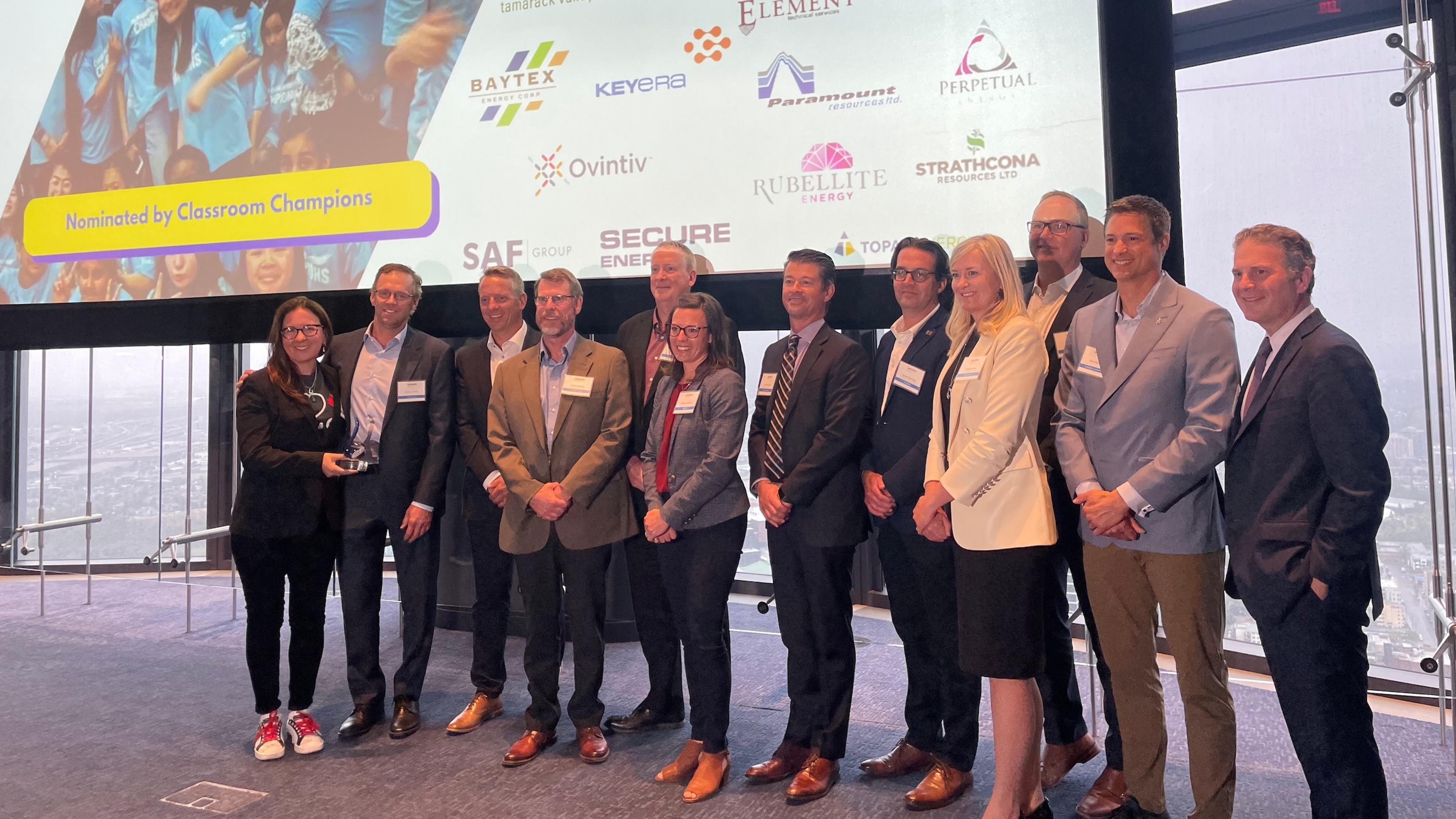 Group receives the AFP Outstanding Philanthropic Group award, nominated by Classroom Champions, before sponsor company logos.