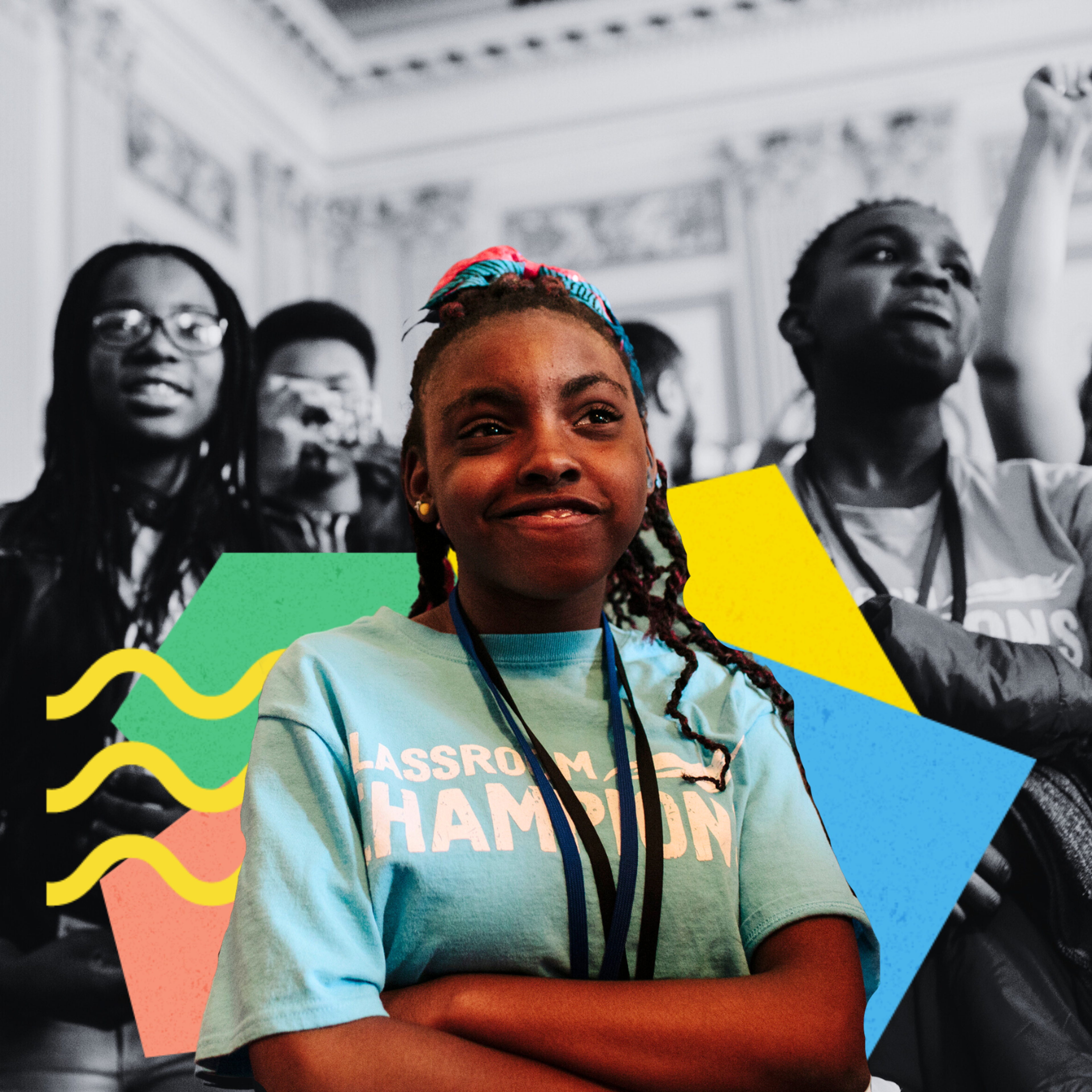 A smiling student wears a Classroom Champions t-shirt, with classmates celebrating in the background.