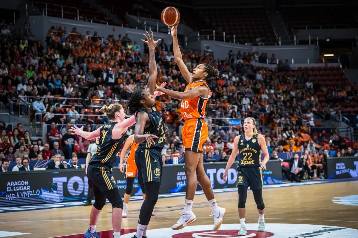 Kayla Alexander competing in Basketball