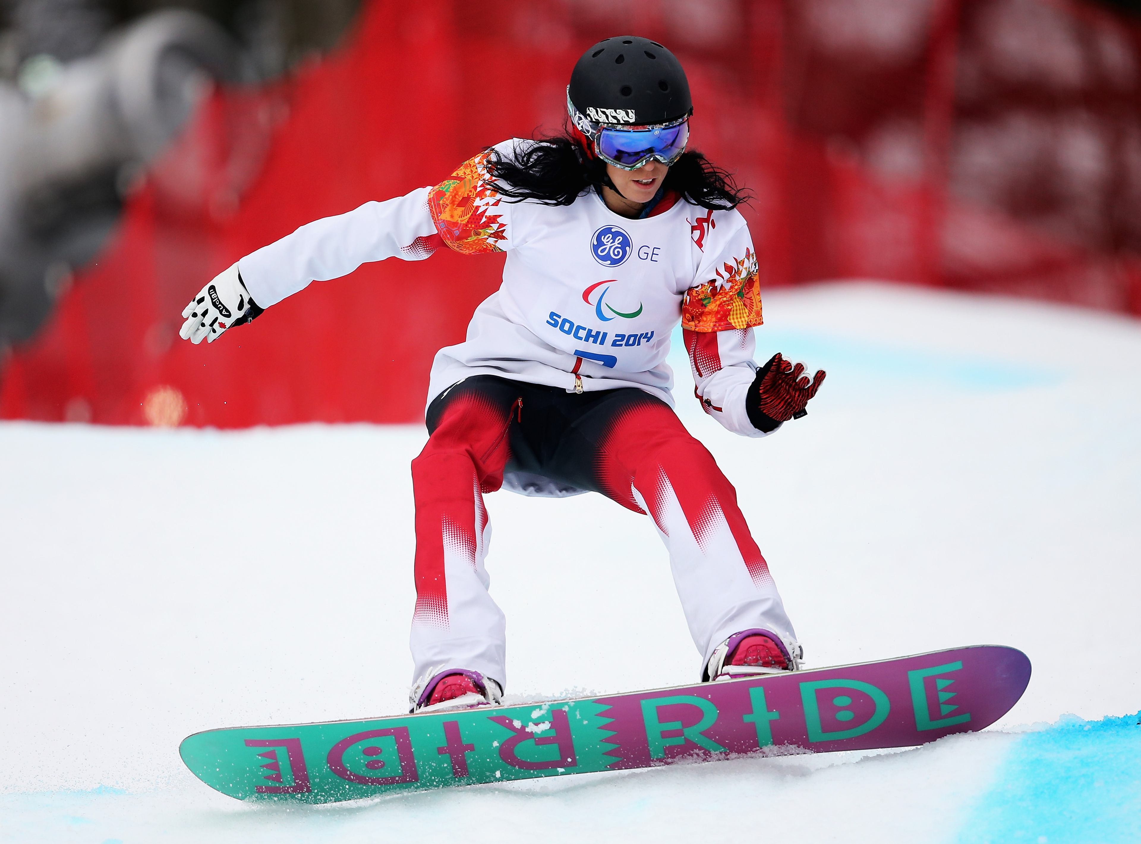 A snowboarder competes in the Sochi 2014 Paralympic Winter Games.